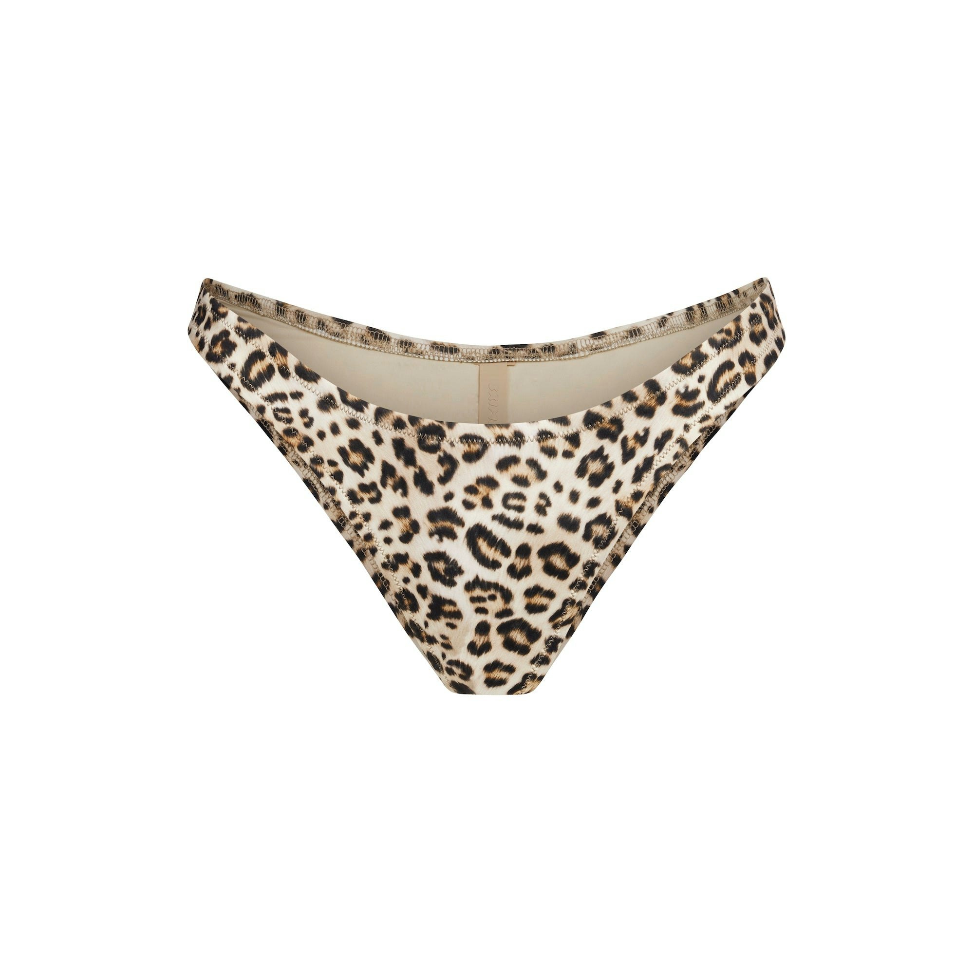 SIGNATURE SWIM TANGA BIKINI BOTTOM | CHAMPAGNE LEOPARD PRINT FLAT ON A WHITE BACKGROUND | FLT
