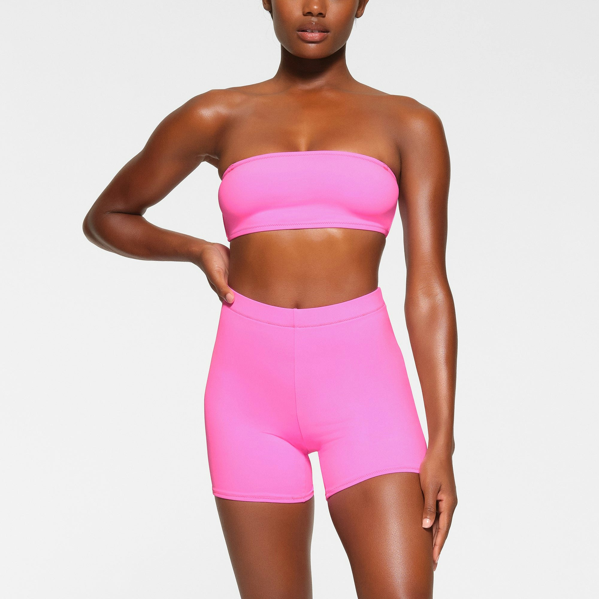 SWIM MID WAIST SHORT WORN BY A MODEL IN FRONT VIEW