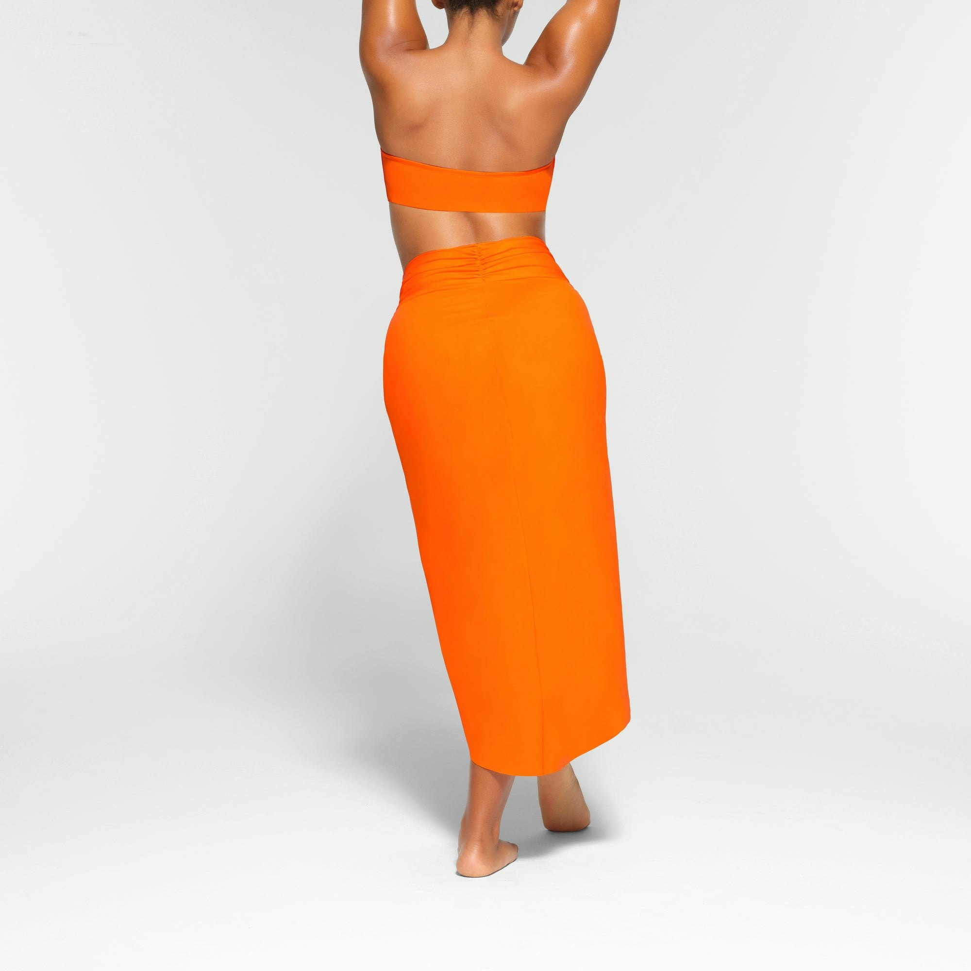 SWIM SARONG SKIRT WORN BY A MODEL IN BACK VIEW