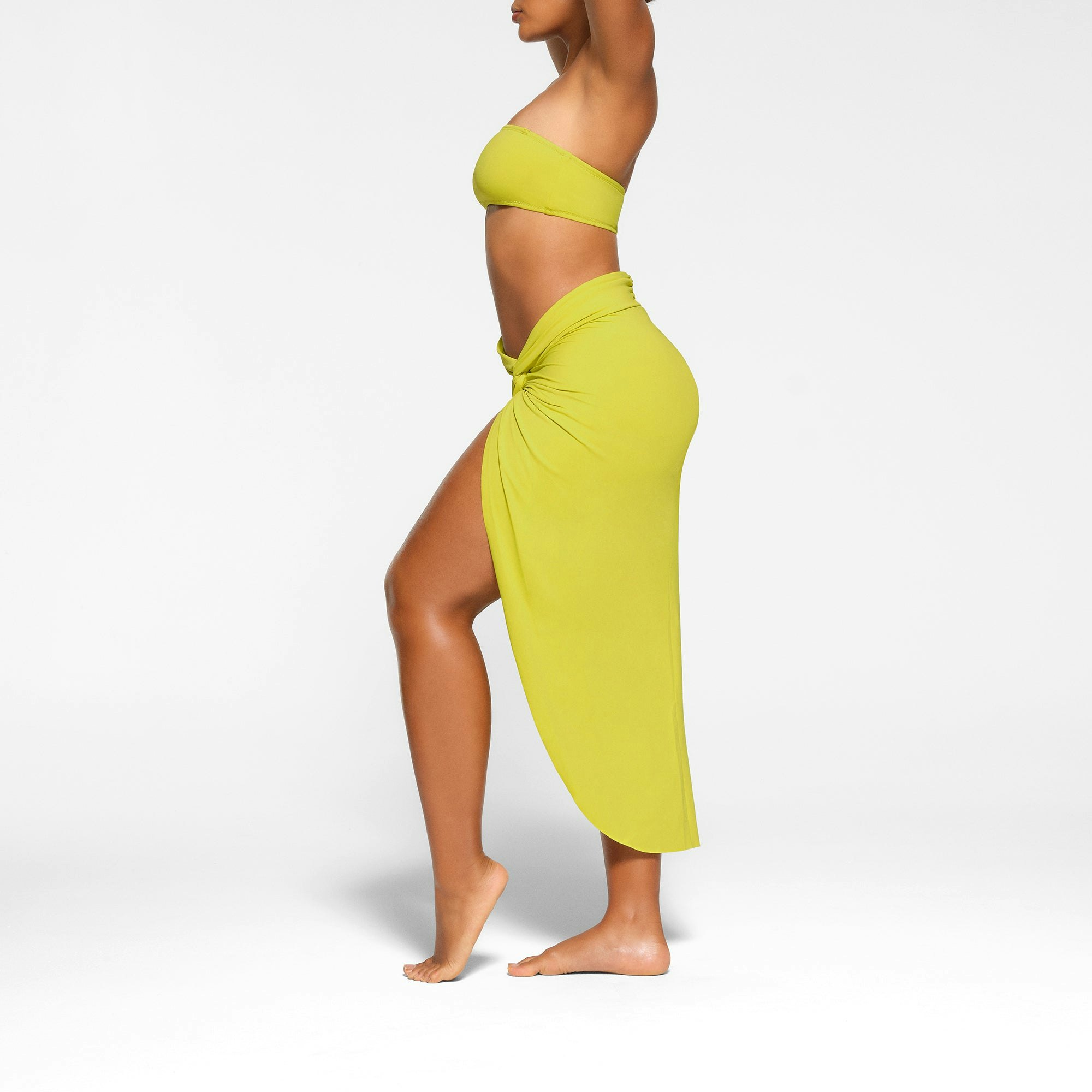 SWIM SARONG SKIRT WORN BY A MODEL IN SIDE VIEW