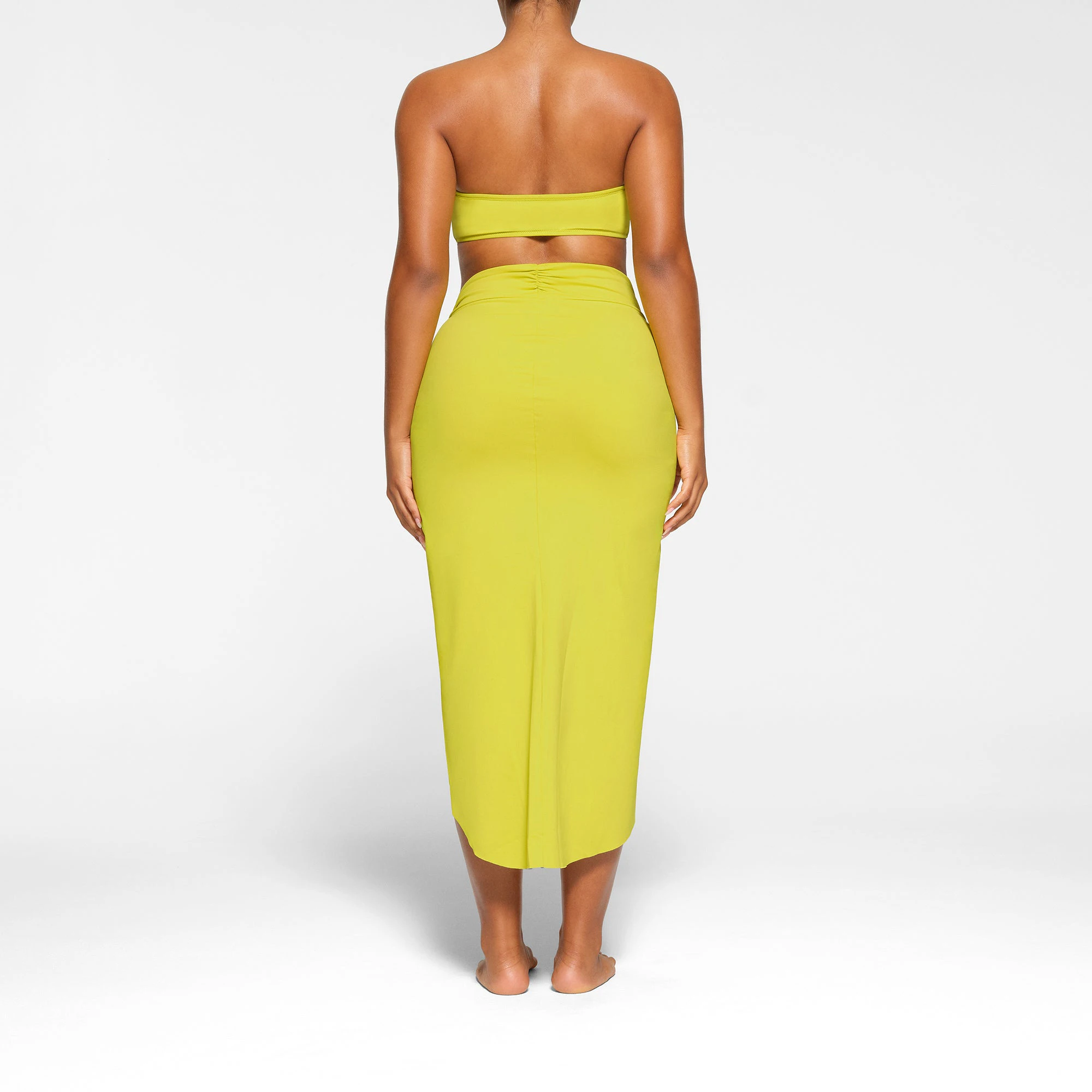 SWIM SARONG SKIRT ON A MODEL BACK VIEW