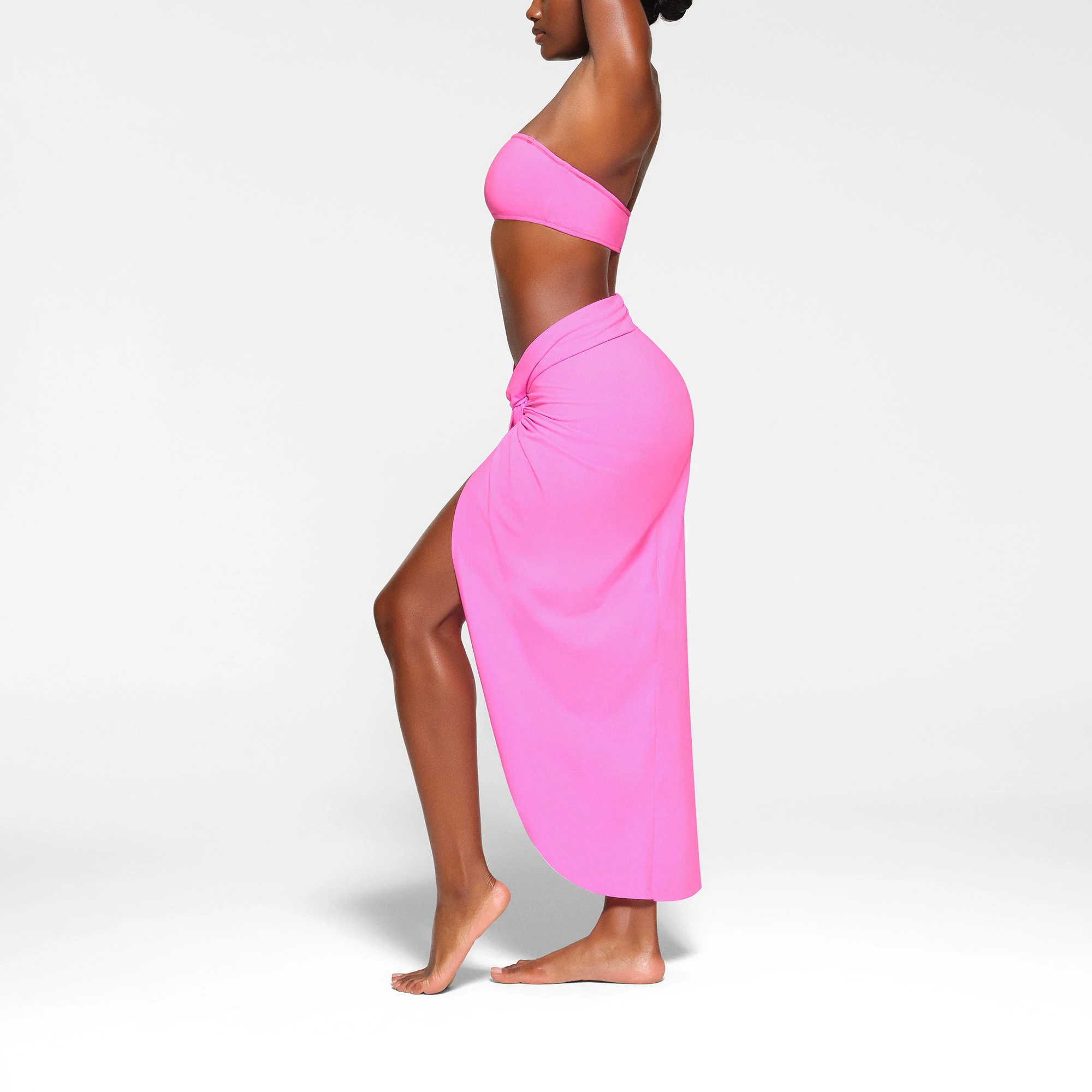 SWIM SARONG SKIRT WORN BY A MODEL IN SIDE VIEW