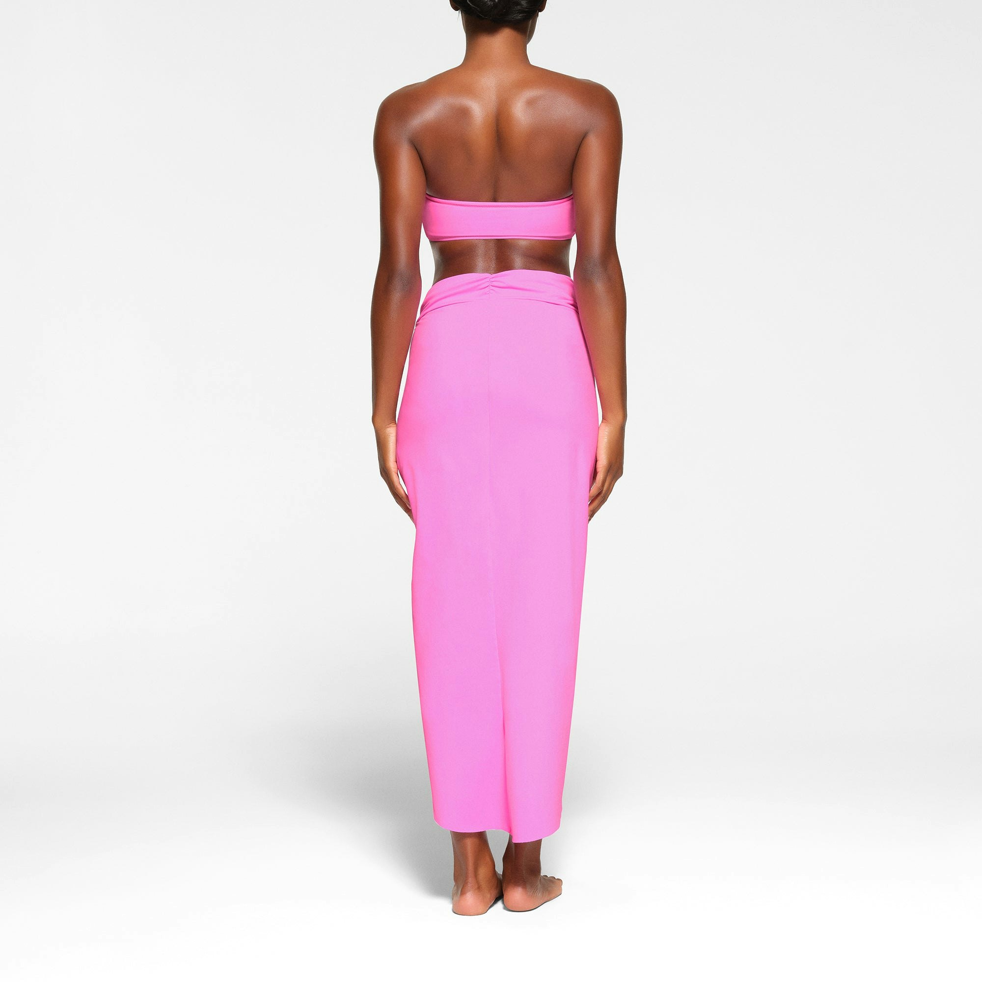 SWIM SARONG SKIRT ON A MODEL BACK VIEW