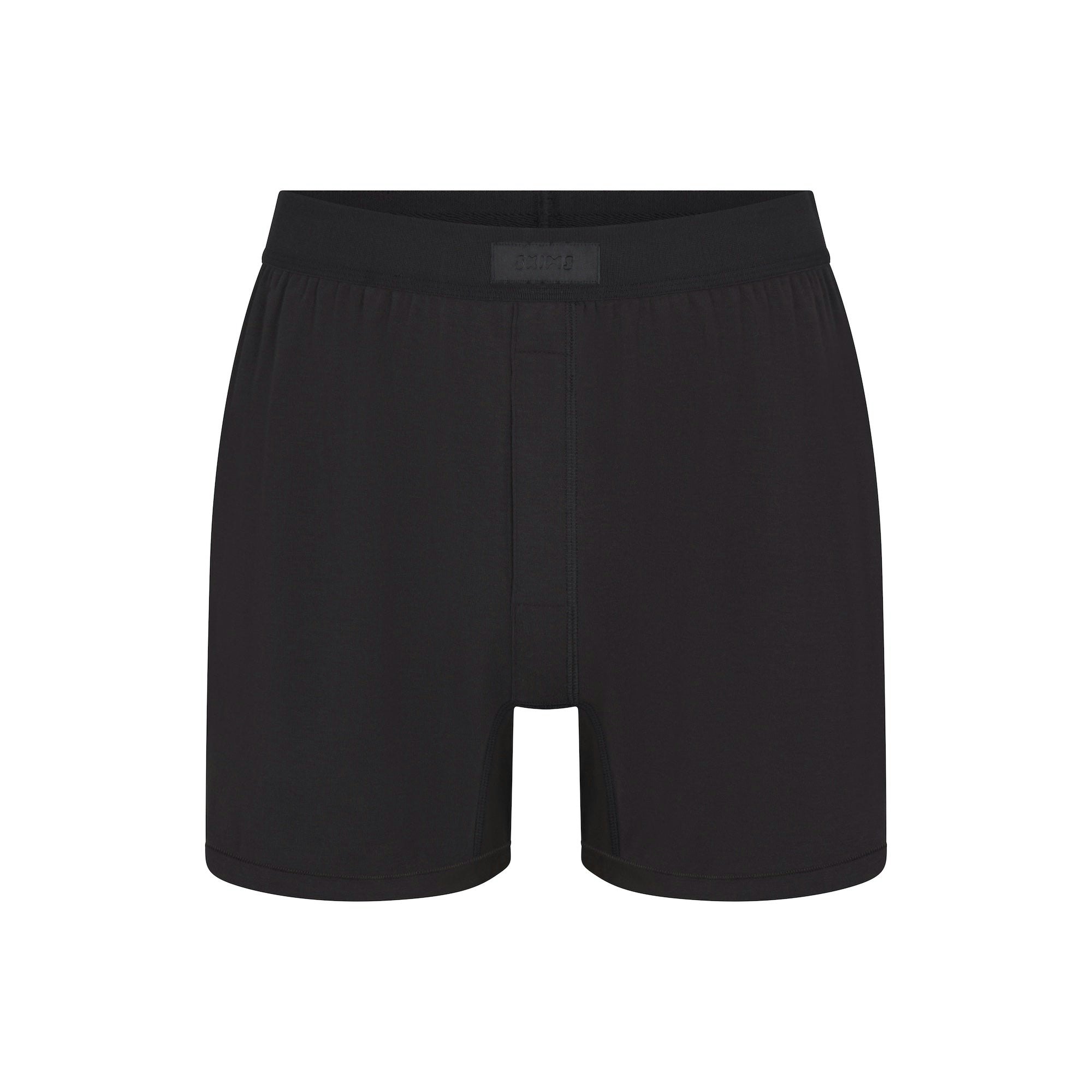 SKIMS COTTON MENS KNIT BOXER | ONYX (MENS BOXERS) FLAT ON A WHITE BACKGROUND | FLT