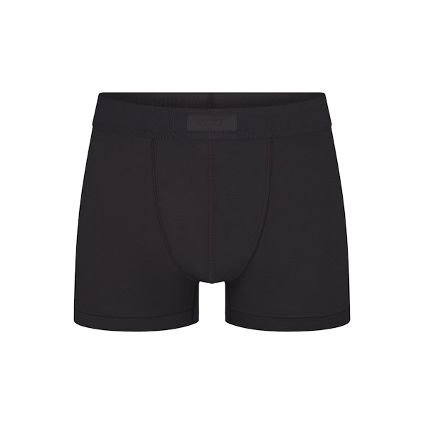 SKIMS COTTON MENS TRUNK | ONYX (MENS BOXERS) FLAT ON A WHITE BACKGROUND | FLT