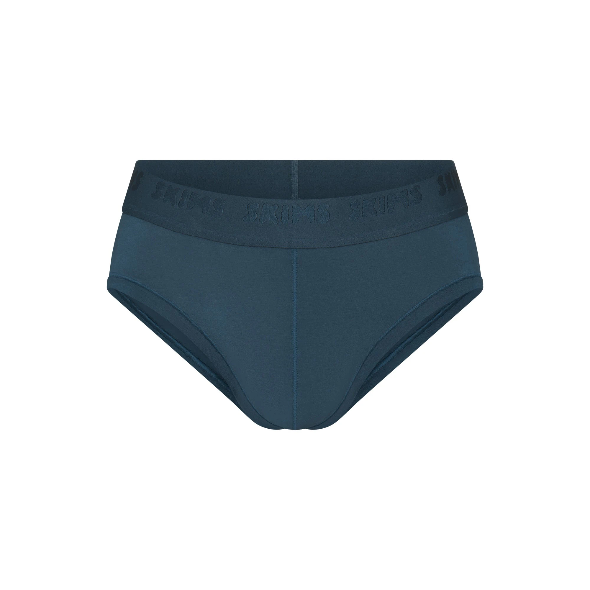 SKIMS STRETCH MENS BRIEF | INDIGO FLAT ON A WHITE BACKGROUND | FLT | FOCUS: 0.0, 1.0, 0.9