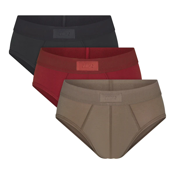 SKIMS COTTON MENS BRIEF 3-PACK | MERLOT MULTI (MENS BRIEFS) FLAT ON A WHITE BACKGROUND
