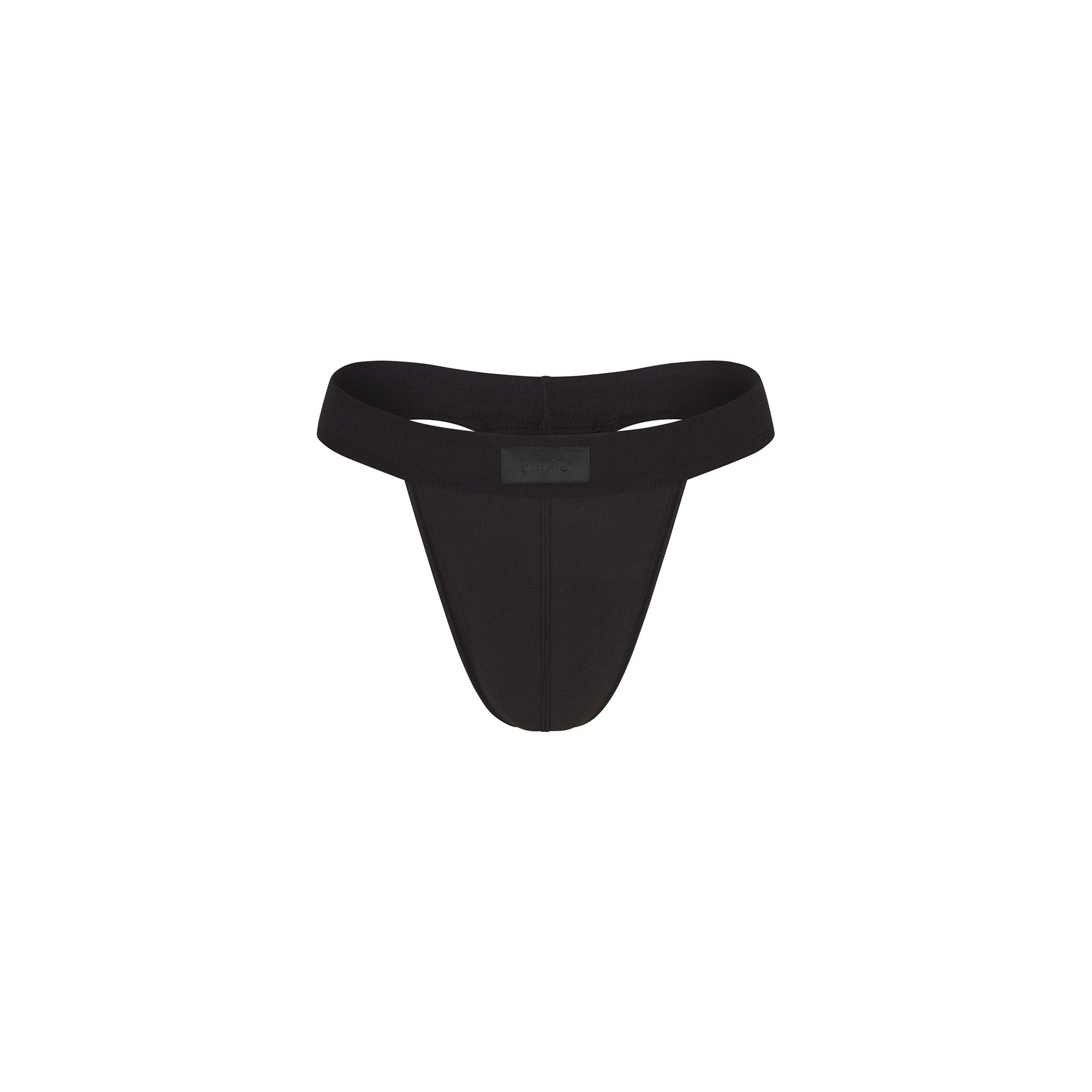 SKIMS COTTON MENS THONG | ONYX FLAT ON A WHITE BACKGROUND @ | FOCUS: 0.0, 1.0, 0.9