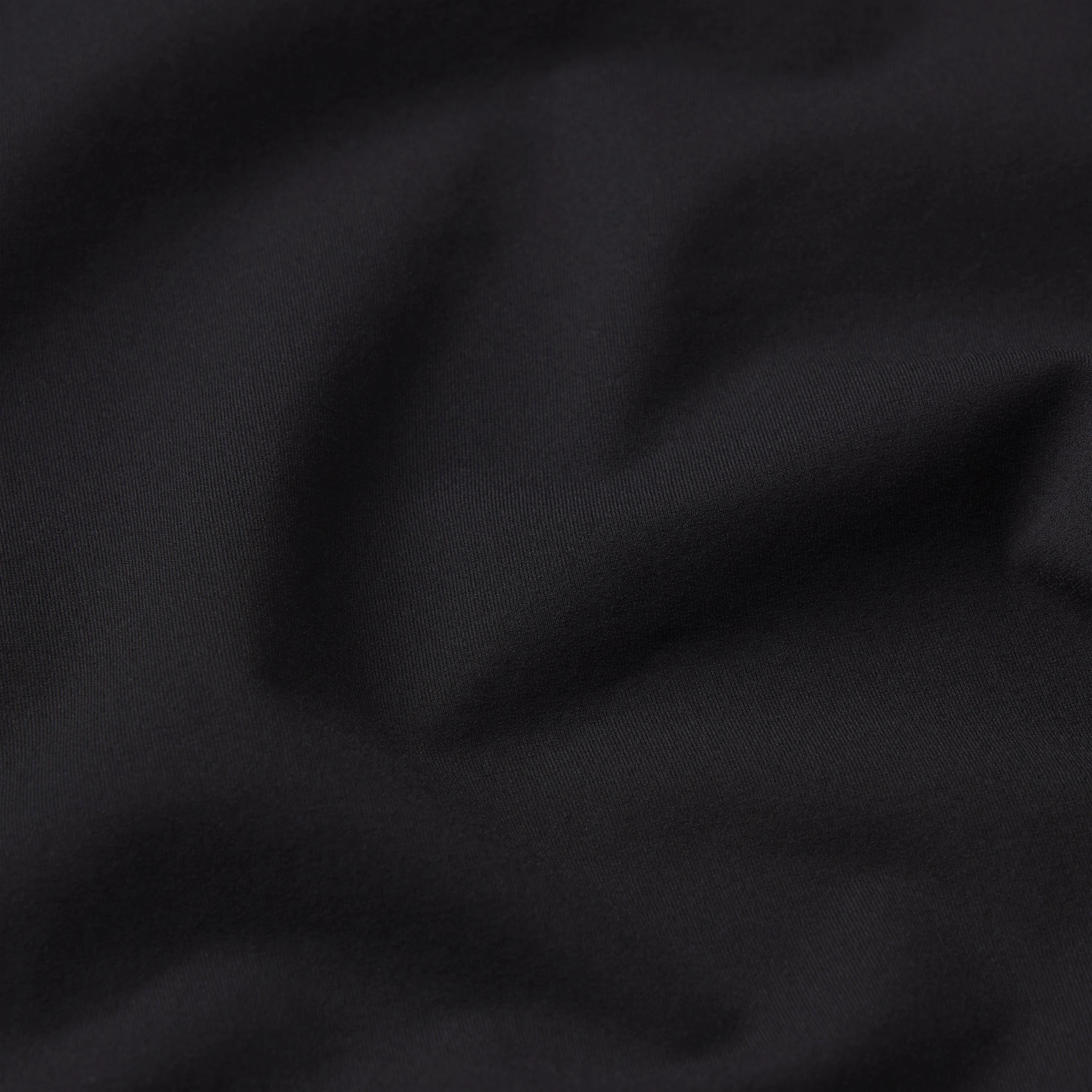 NikeSKIMS WEIGHTLESS LAYERS MOCK NECK SHORT SLEEVE T-SHIRT | OBSIDIAN & LAYS FLAT ON A WHITE BACKGROUND | FLT