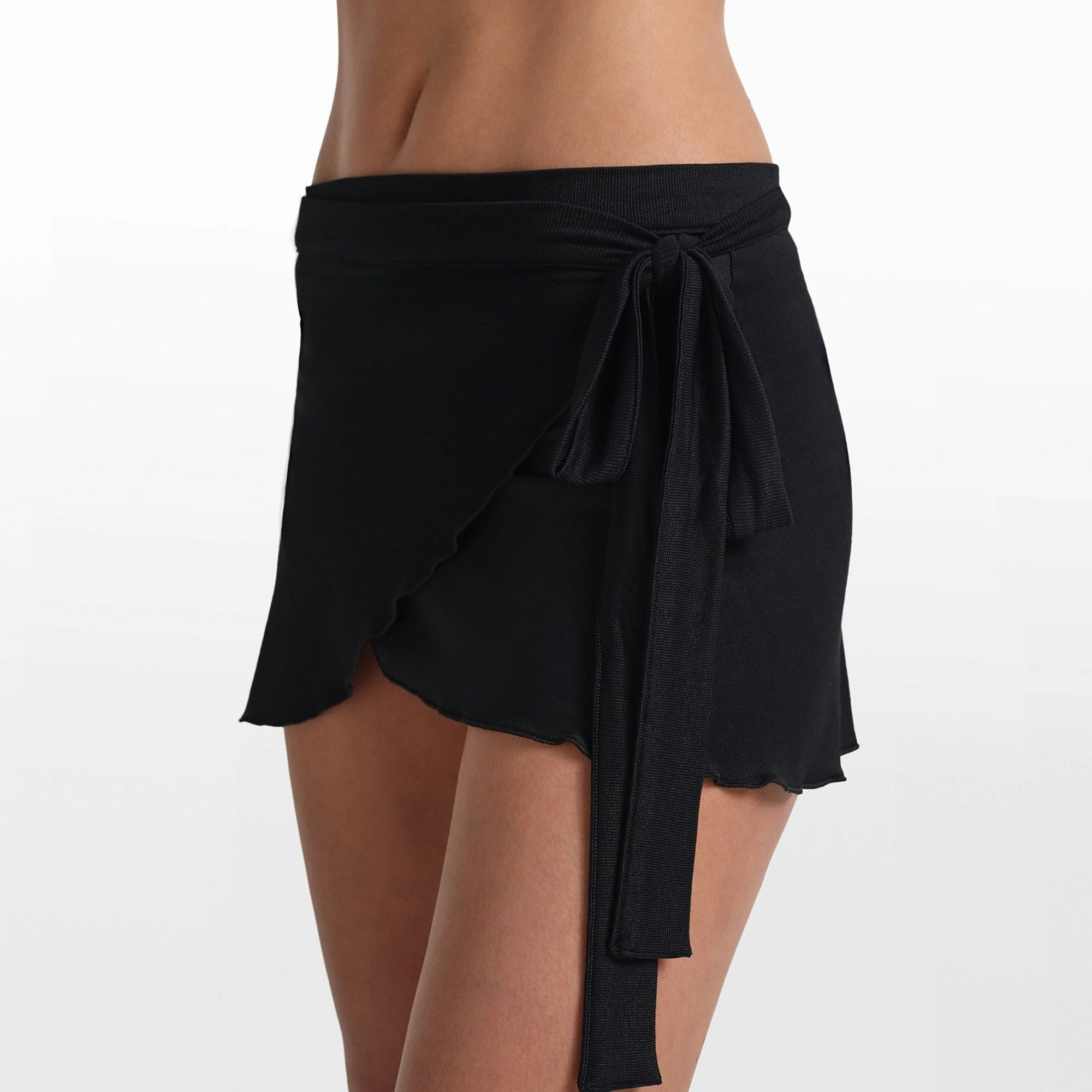 NikeSKIMS STRETCH KNIT WRAP SKIRT | OBSIDIAN ON A MODEL FRONT VIEW @ | FOCUS: 0.0, 1.0, 0.9
