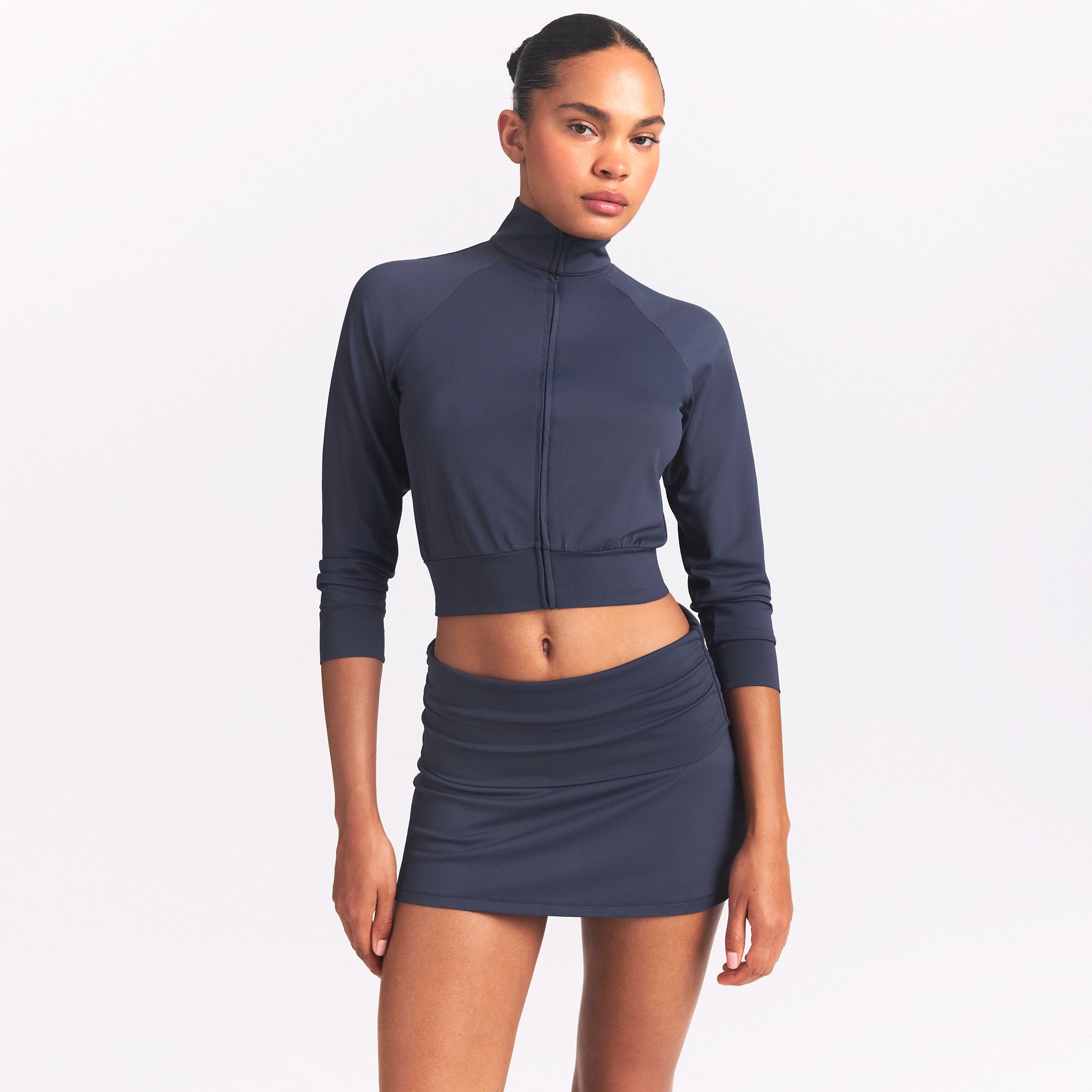 NikeSKIMS AIRY FOLDOVER SKORT | DEEP ROYAL ON A MODEL SIDE VIEW @ | FOCUS: 0.0, 1.0, 0.9