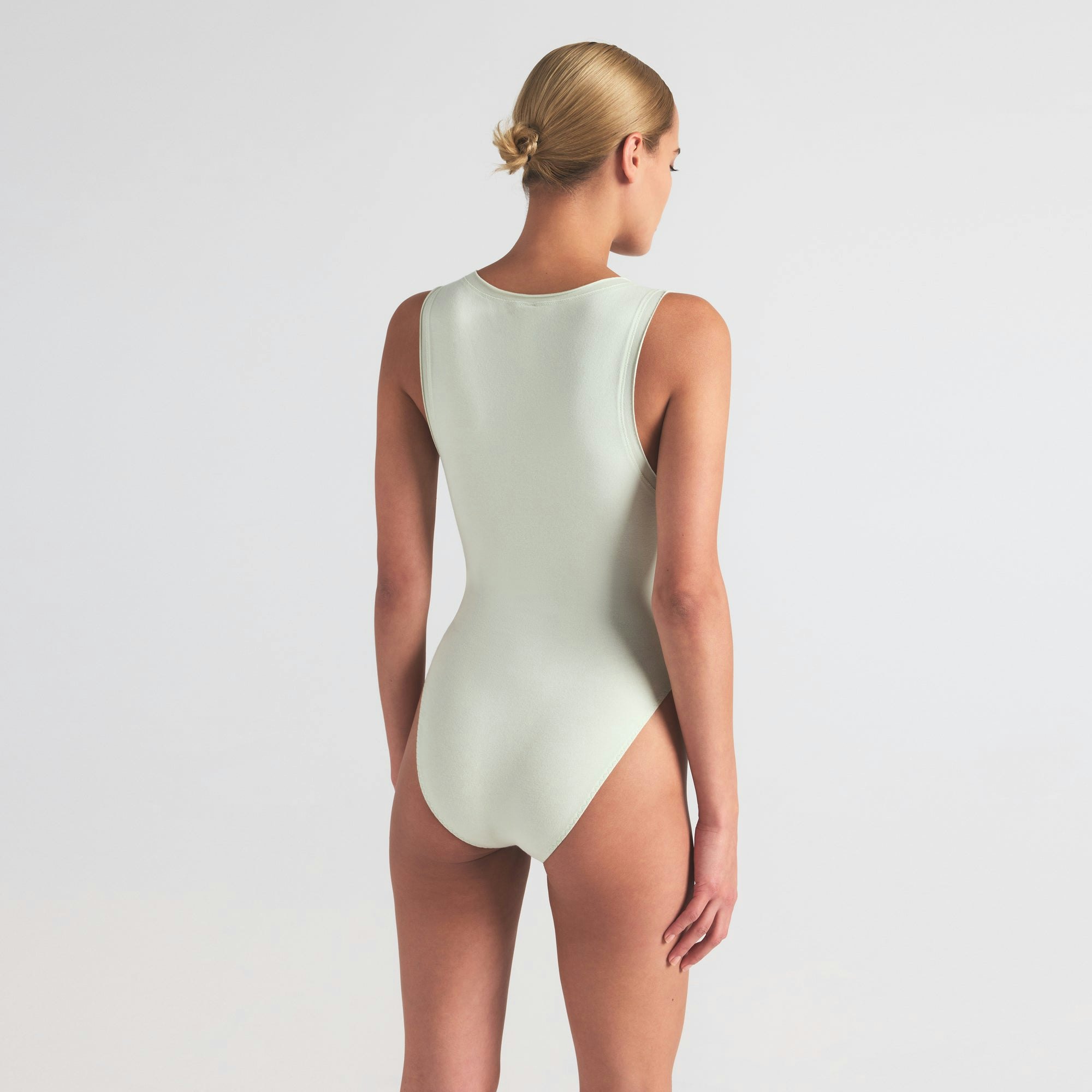 COTTON JERSEY TANK BODYSUIT | SPEARMINT ON A MODEL SIDE VIEW | FOCUS: 0.0, 1.0, 0.9