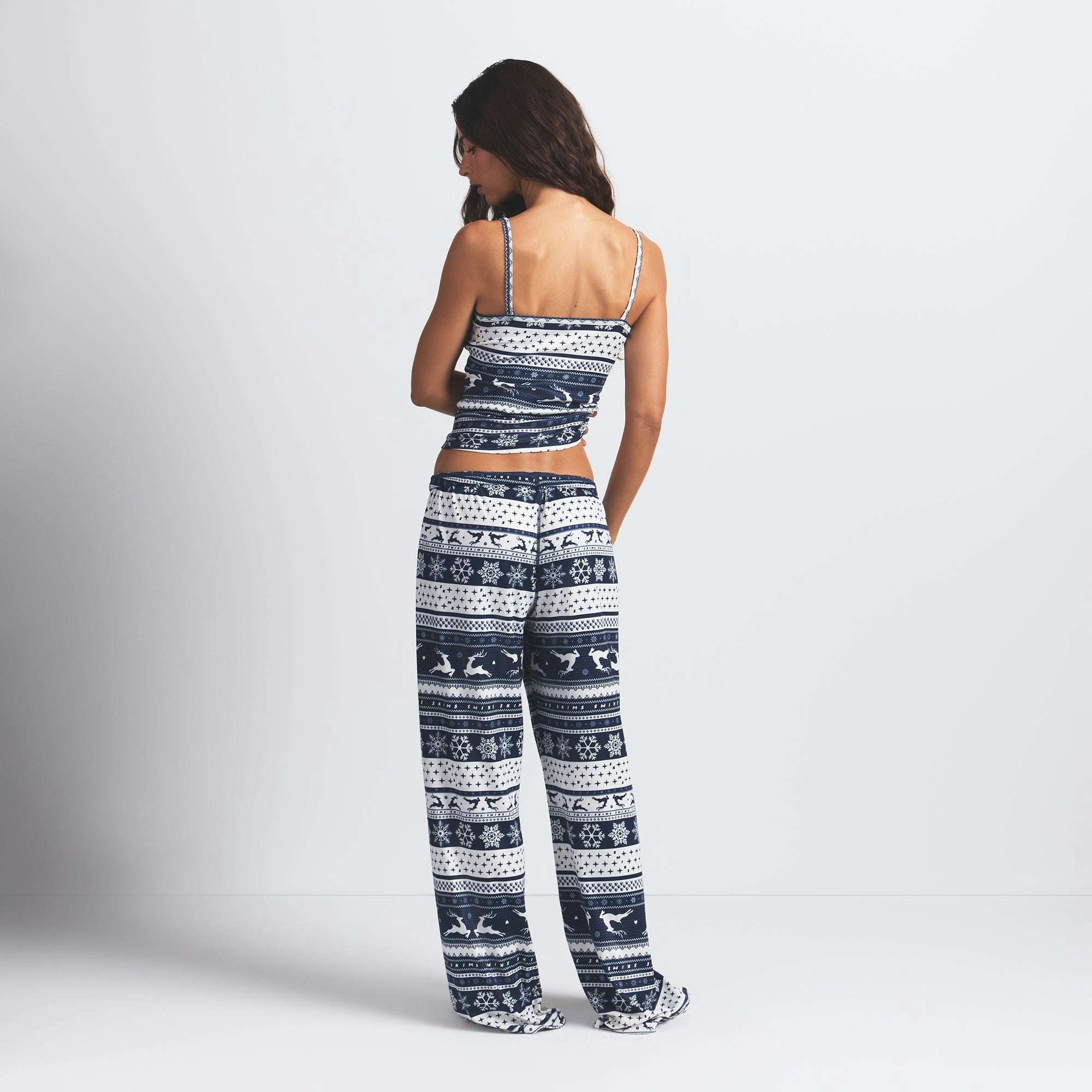 LOGO PLUSH POINTELLE CAMI | NAVY DEER FAIR ISLE ON A MODEL BACK VIEW @ | FOCUS: 0.0, 1.0, 0.9