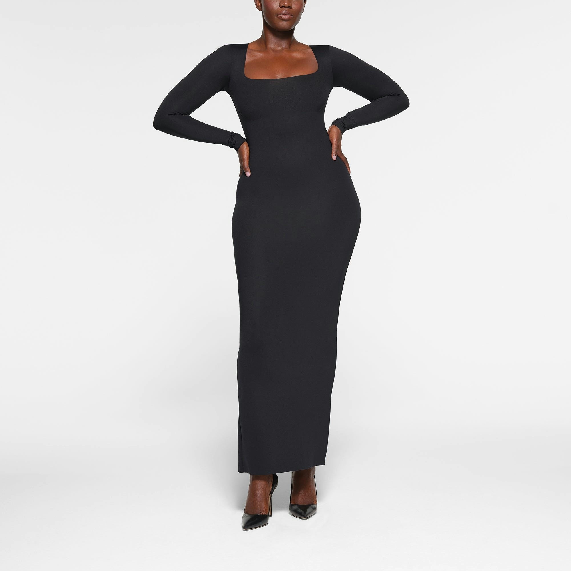 SKIMS BODY LONG SLEEVE LONG DRESS WORN BY A MODEL IN FRONT VIEW | SEE: M, L, XL