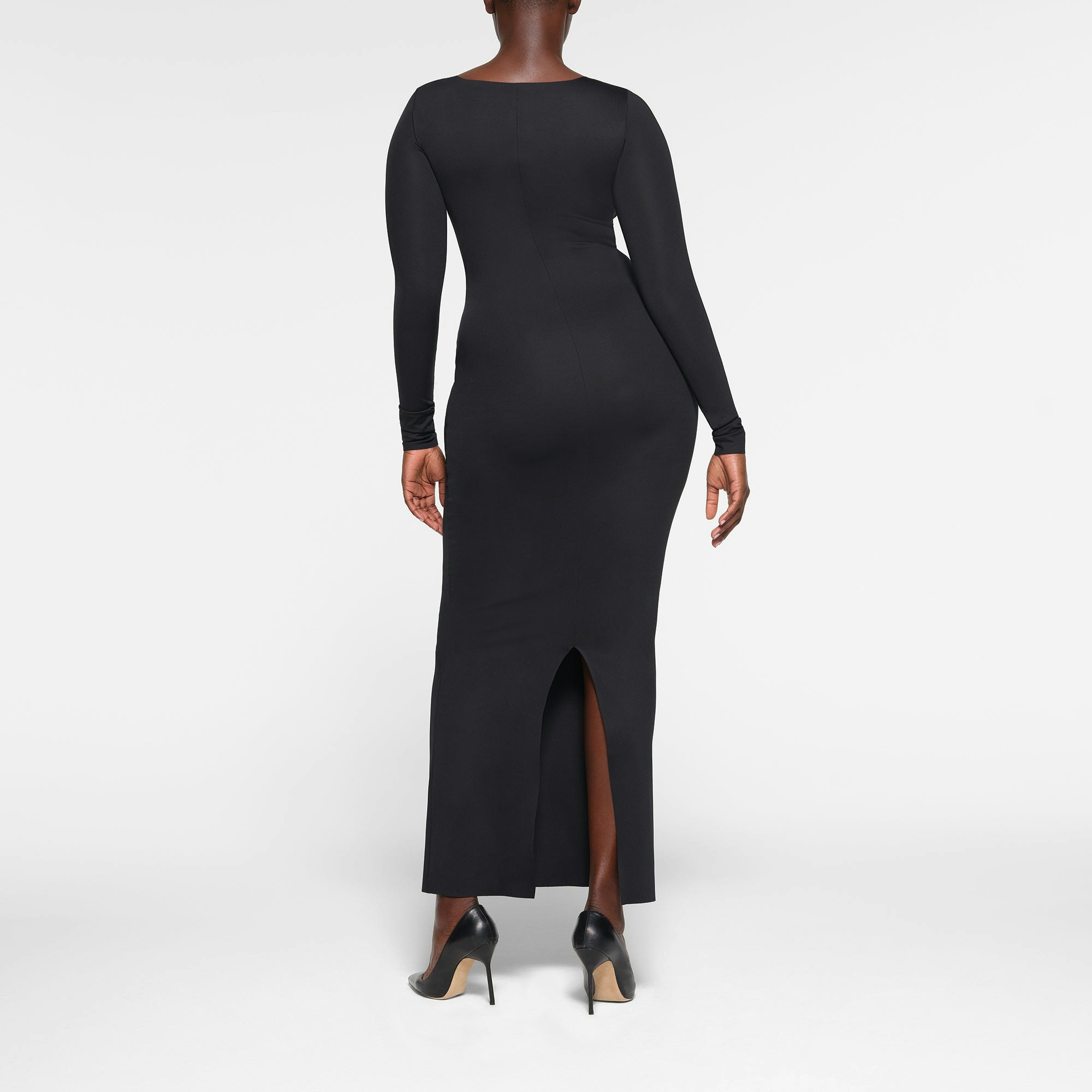 SKIMS BODY LONG SLEEVE LONG DRESS ON A MODEL BACK VIEW