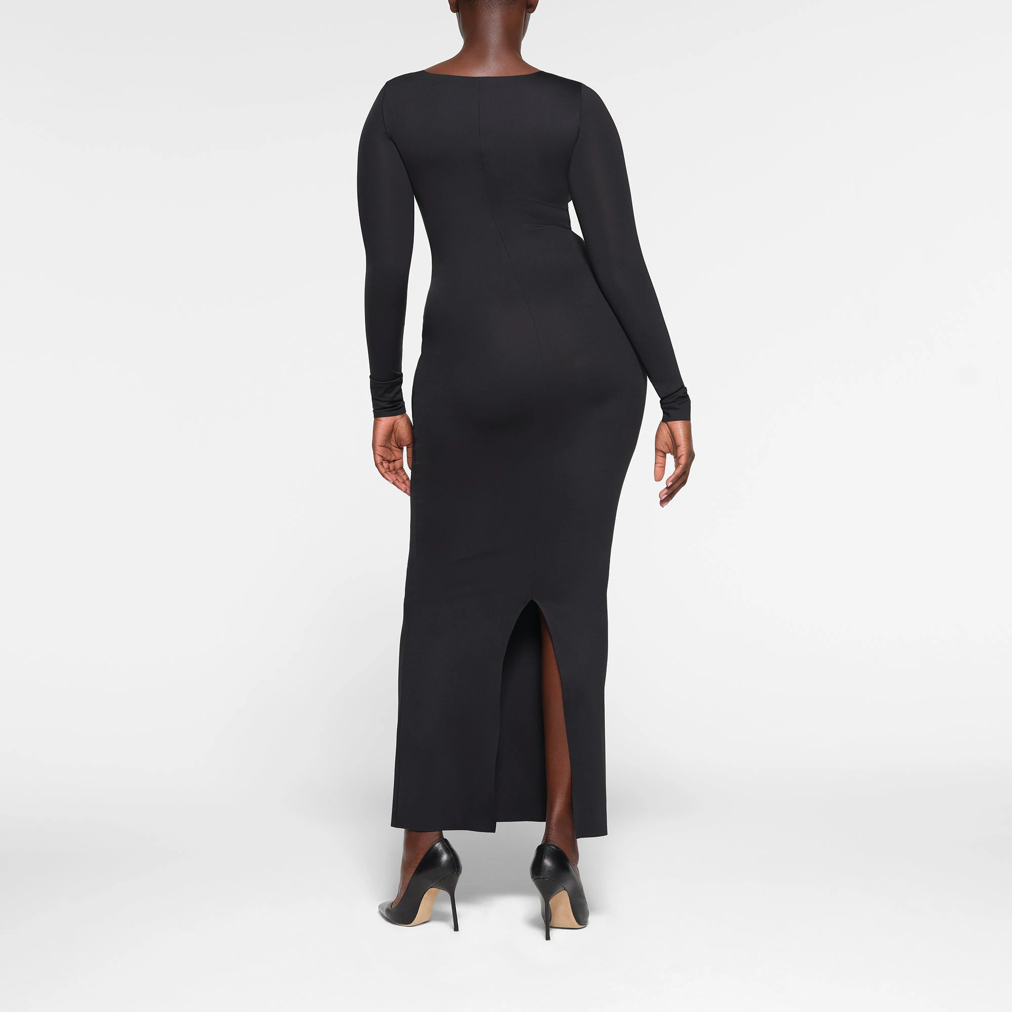 SKIMS BODY LONG SLEEVE LONG DRESS ON A MODEL BACK VIEW