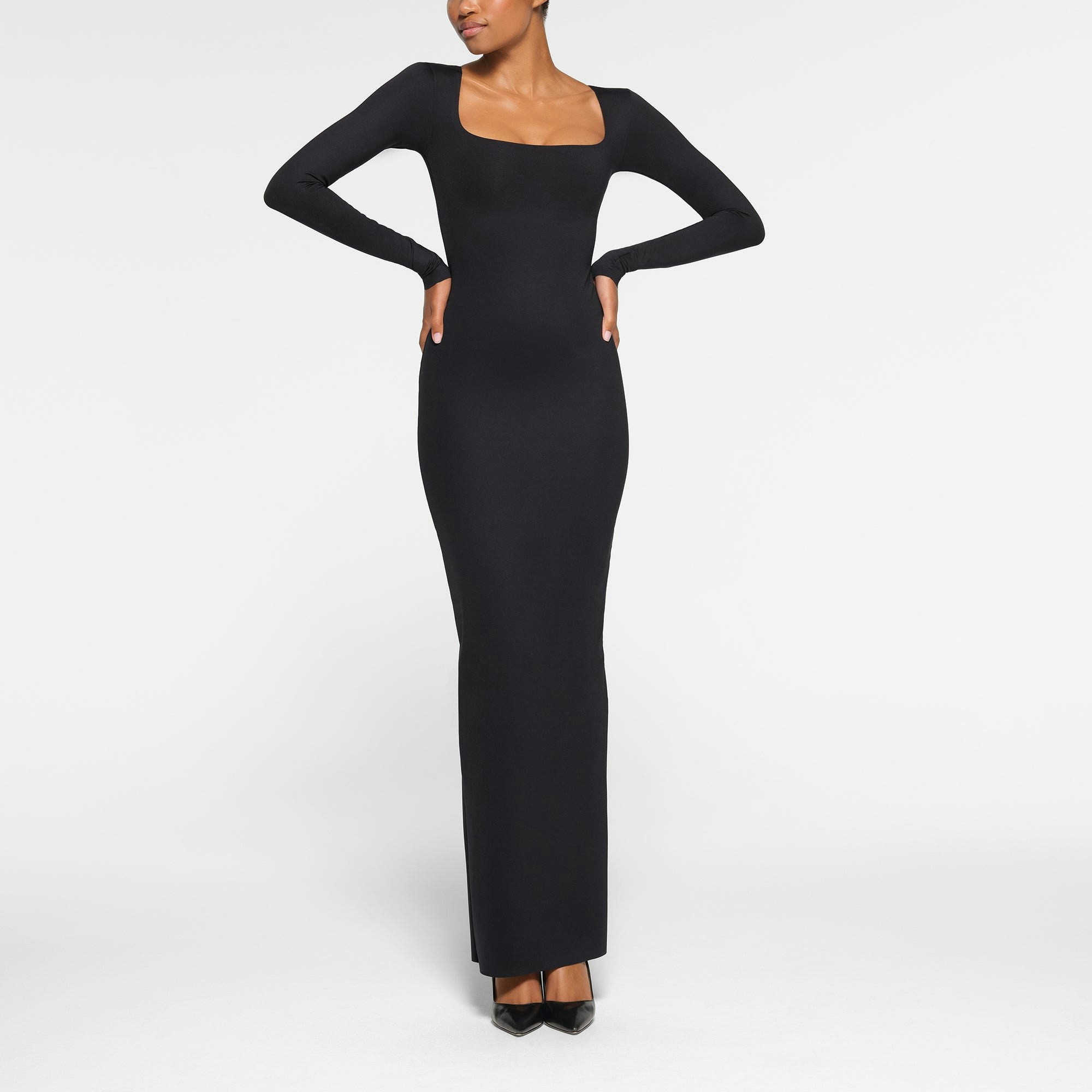 SKIMS BODY LONG SLEEVE LONG DRESS WORN BY A MODEL IN FRONT VIEW | SEE: XXS, XS, S