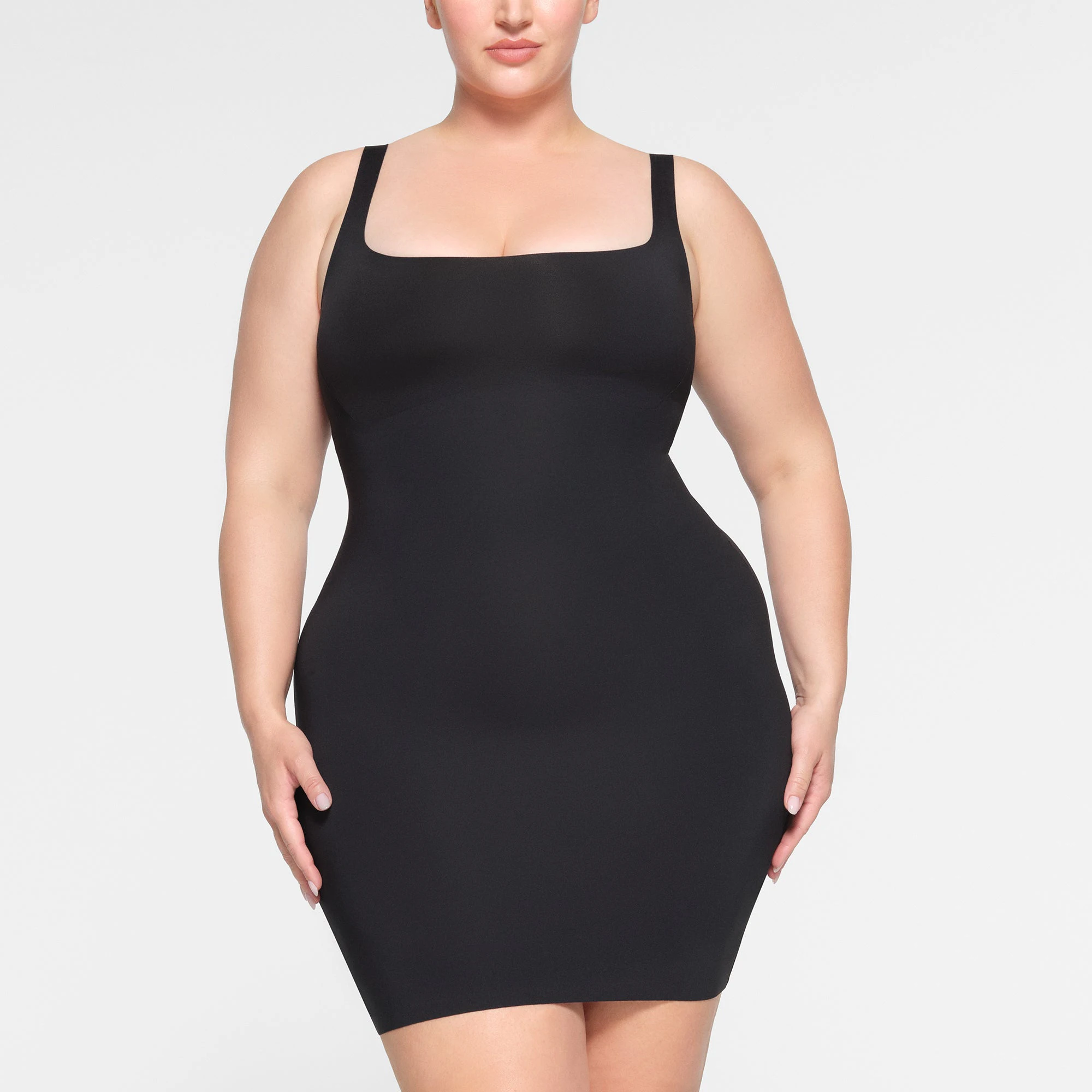 SKIMS BODY TANK MINI DRESS WORN BY A MODEL IN FRONT VIEW | SEE: 2X, 3X, 4X