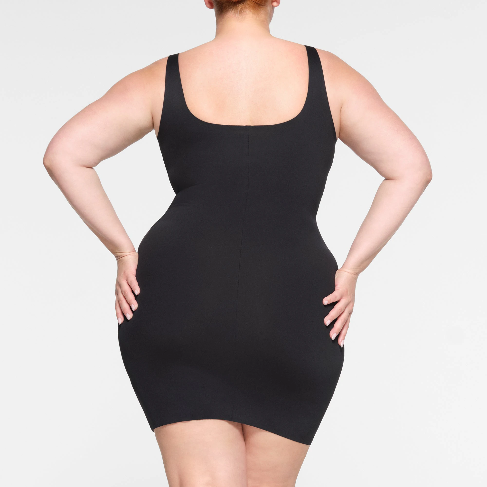SKIMS BODY TANK MINI DRESS ON A MODEL BACK VIEW