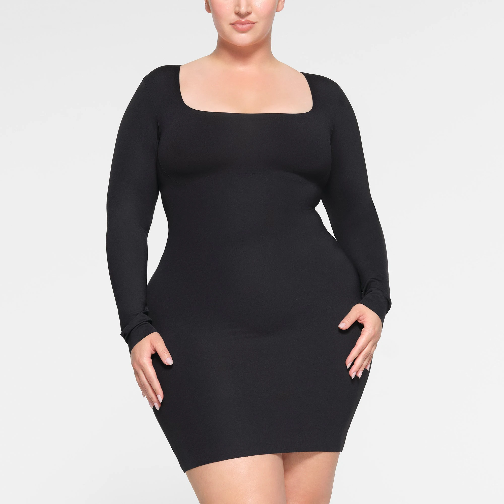 SKIMS BODY LONG SLEEVE MINI DRESS WORN BY A MODEL IN FRONT VIEW | SEE: 2X, 3X, 4X