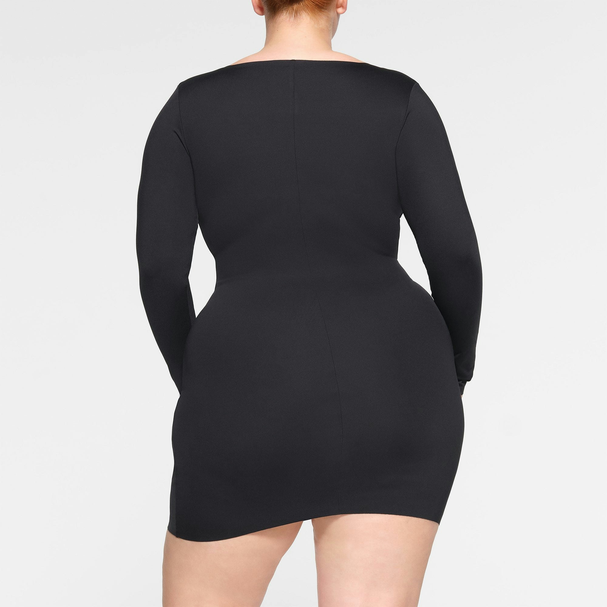 SKIMS BODY LONG SLEEVE MINI DRESS ON A MODEL BACK VIEW