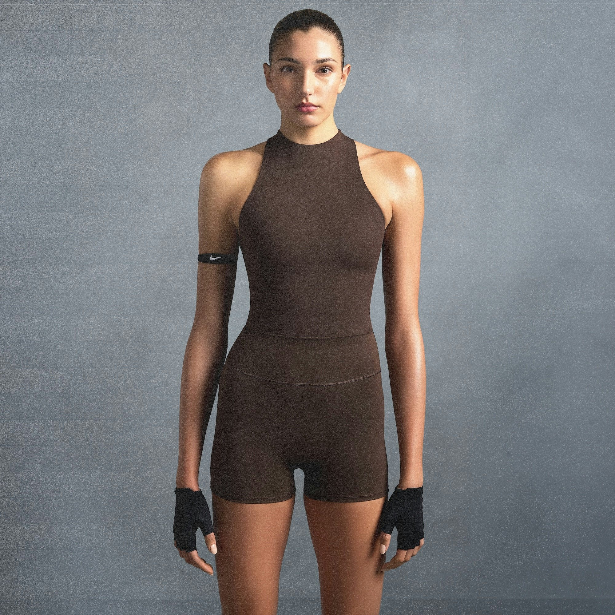 NikeSKIMS MATTE MOCK NECK RACER TANK | DARK SEPIA ON A MODEL SIDE VIEW @ | FOCUS: 0.0, 1.0, 0.9