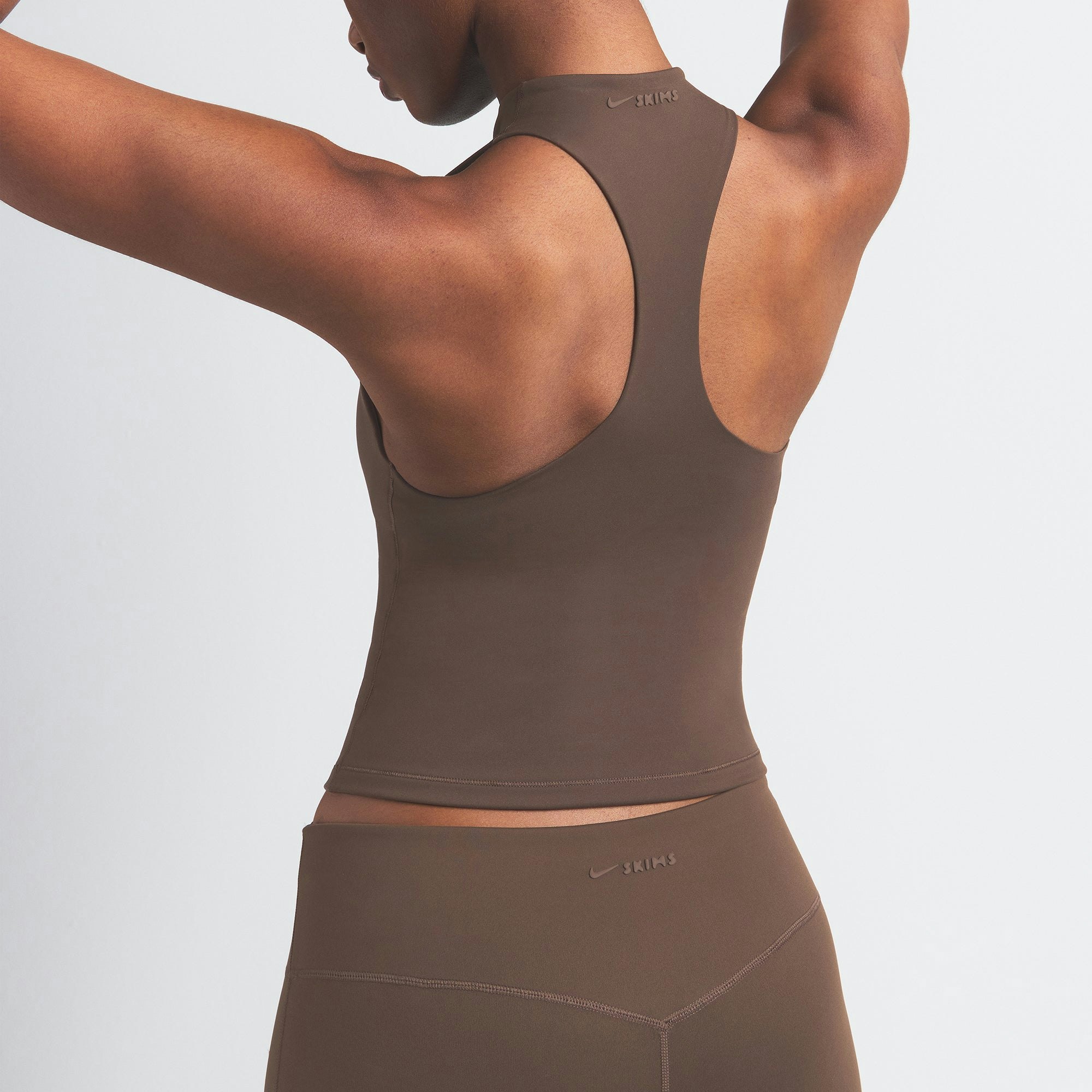 NikeSKIMS MATTE MOCK NECK RACER TANK | DARK SEPIA ON A MODEL BACK VIEW
