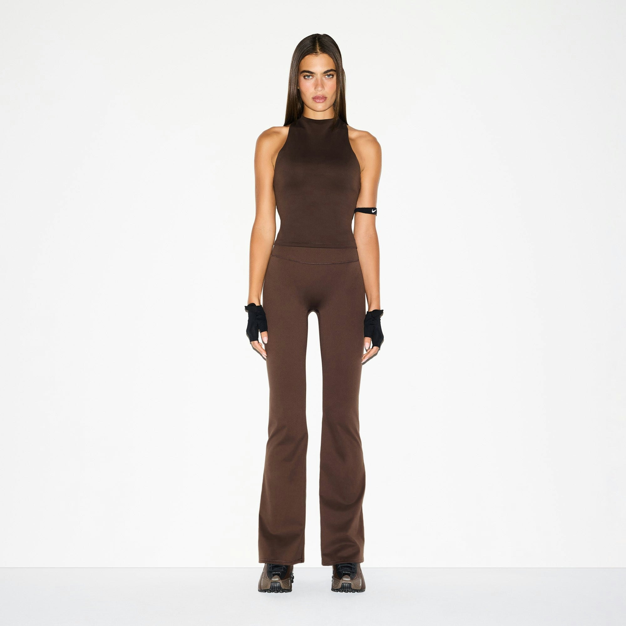 NikeSKIMS MATTE MOCK NECK RACER TANK | DARK SEPIA ON A MODEL FRONT VIEW @ | FOCUS: 0.0, 1.0, 0.9