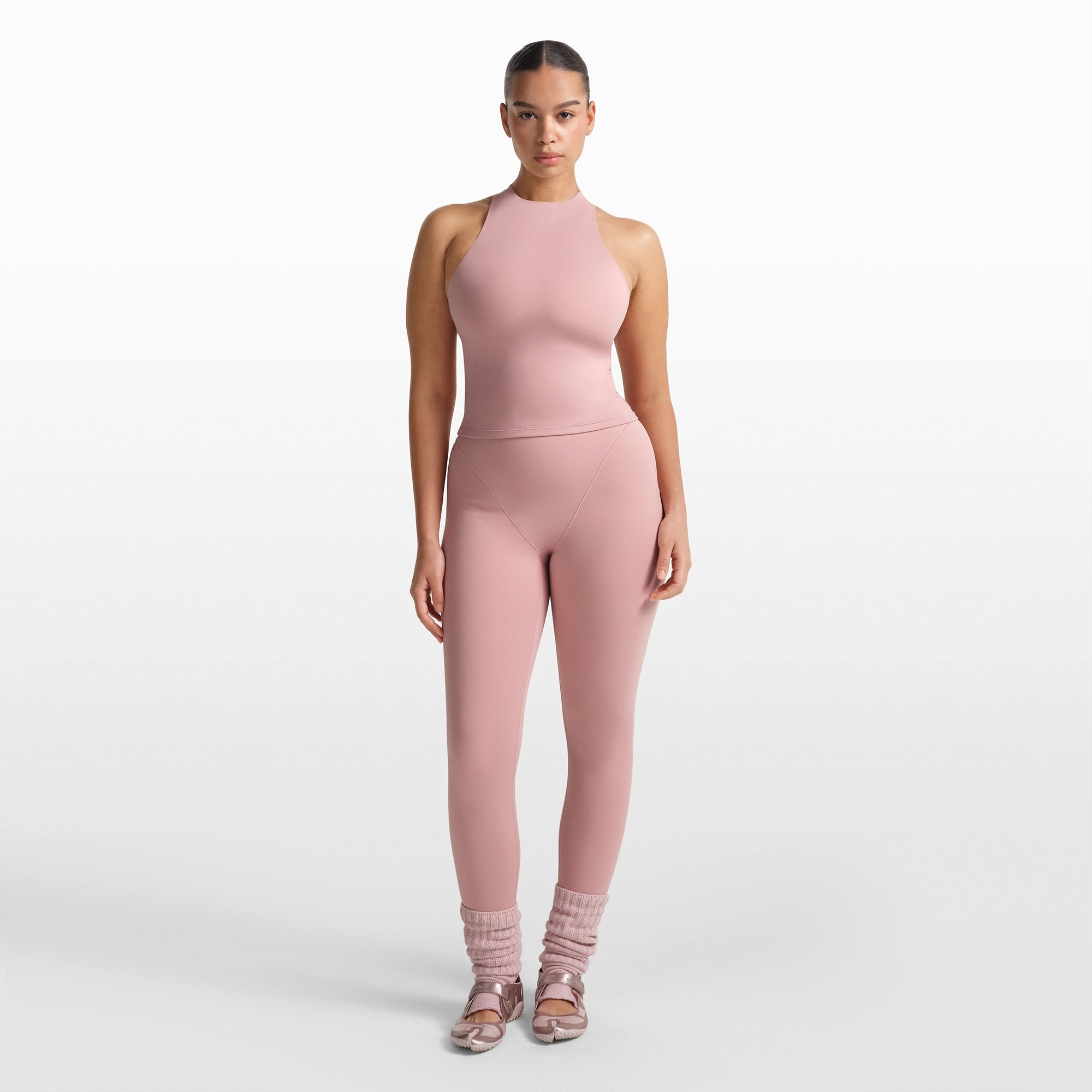 NikeSKIMS MATTE MOCK NECK RACER TANK | HIMALAYAN ON A MODEL FRONT VIEW @ | FOCUS: 0.0, 1.0, 0.9