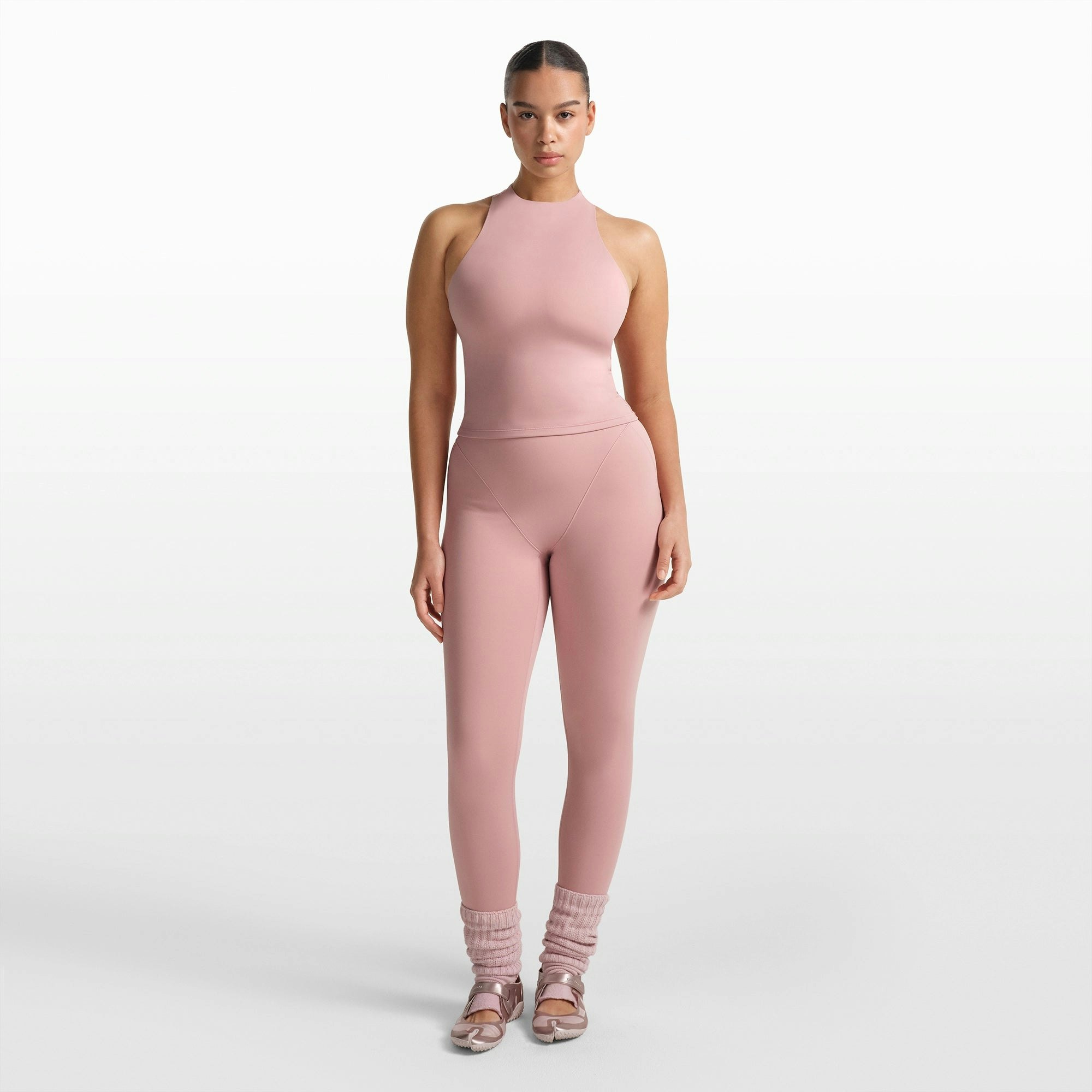 NikeSKIMS MATTE MOCK NECK RACER TANK | HIMALAYAN ON A MODEL FRONT VIEW @ | FOCUS: 0.0, 1.0, 0.9