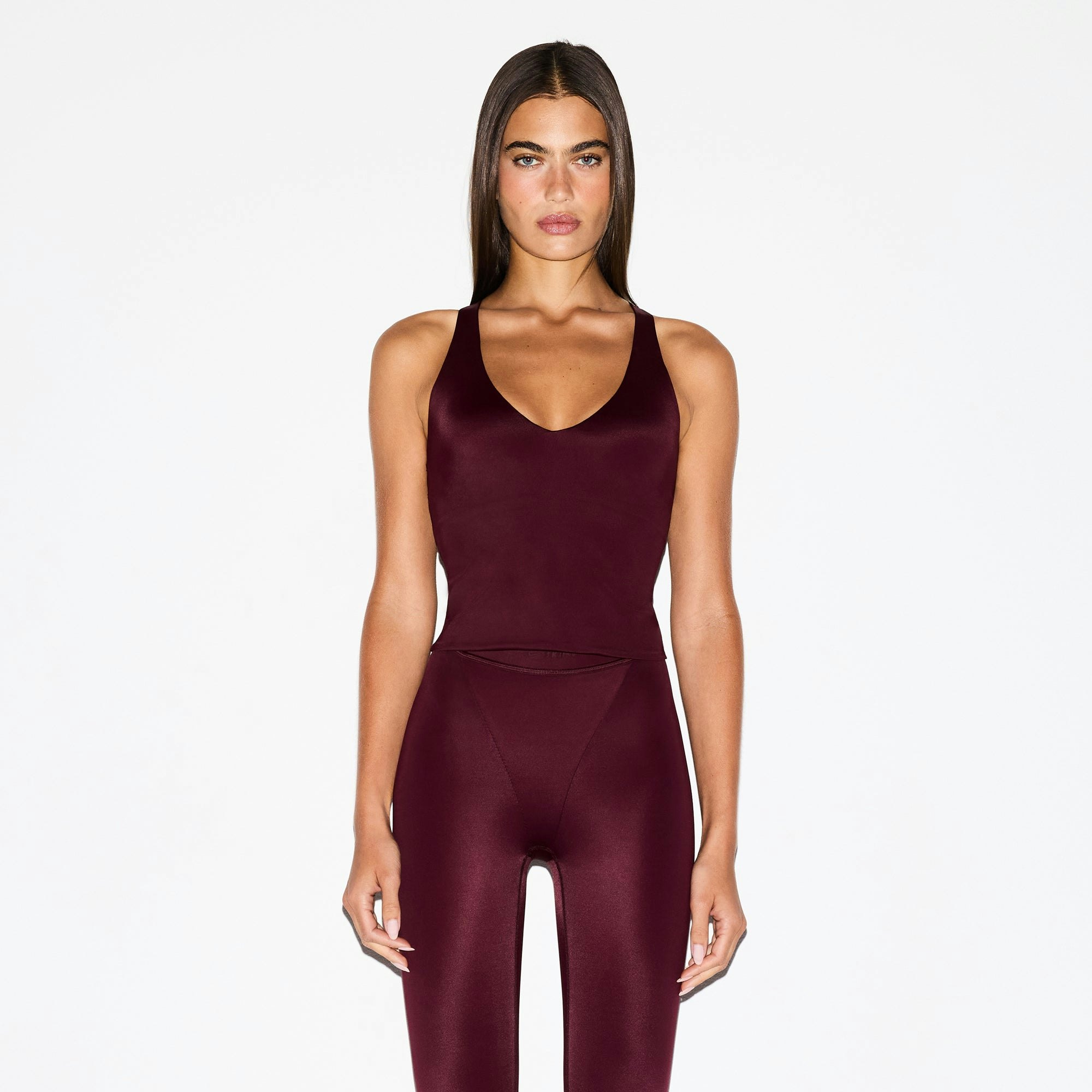 NikeSKIMS SHINE V-NECK TANK | CURRANT ON A MODEL SIDE VIEW @ | FOCUS: 0.0, 1.0, 0.9