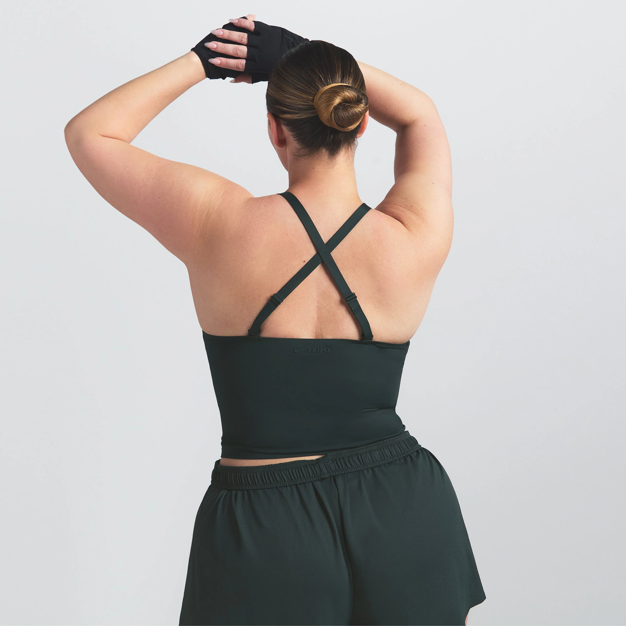 NikeSKIMS SHINE V-NECK TANK | DARK TEAL ON A MODEL SIDE VIEW @ | FOCUS: 0.0, 1.0, 0.9