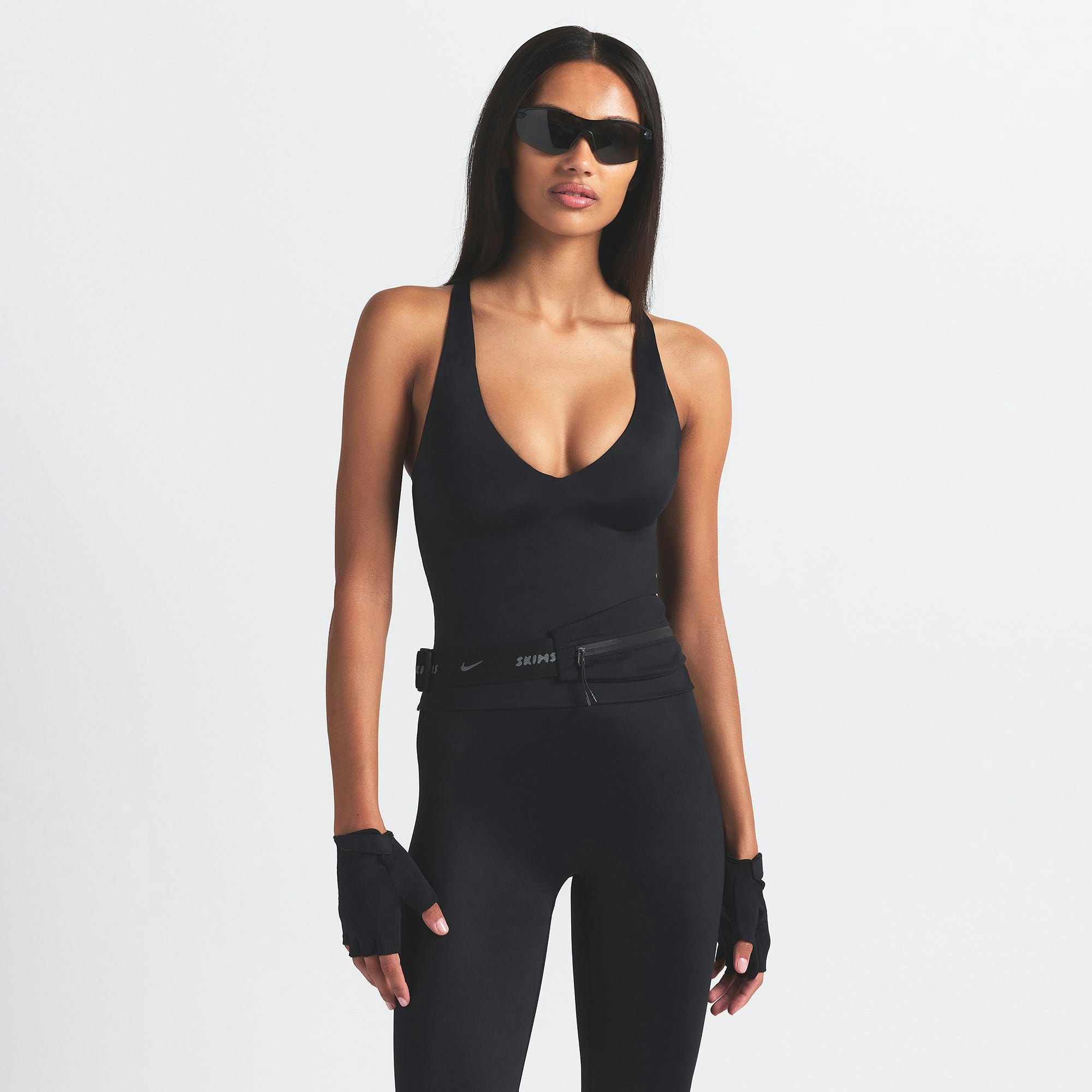 NikeSKIMS SHINE V-NECK TANK | OBSIDIAN ON A MODEL SIDE VIEW