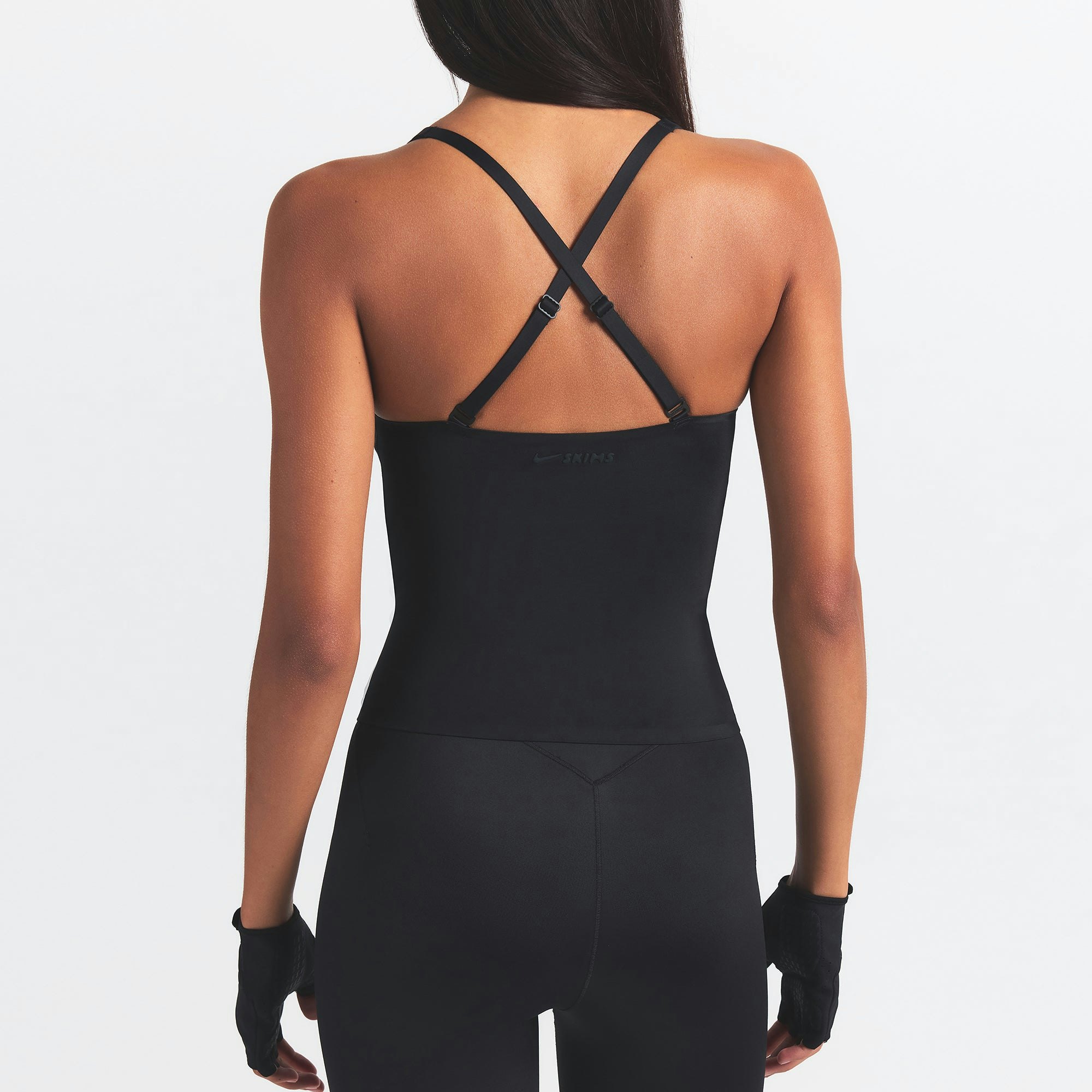 NikeSKIMS SHINE V-NECK TANK | OBSIDIAN ON A MODEL SIDE VIEW