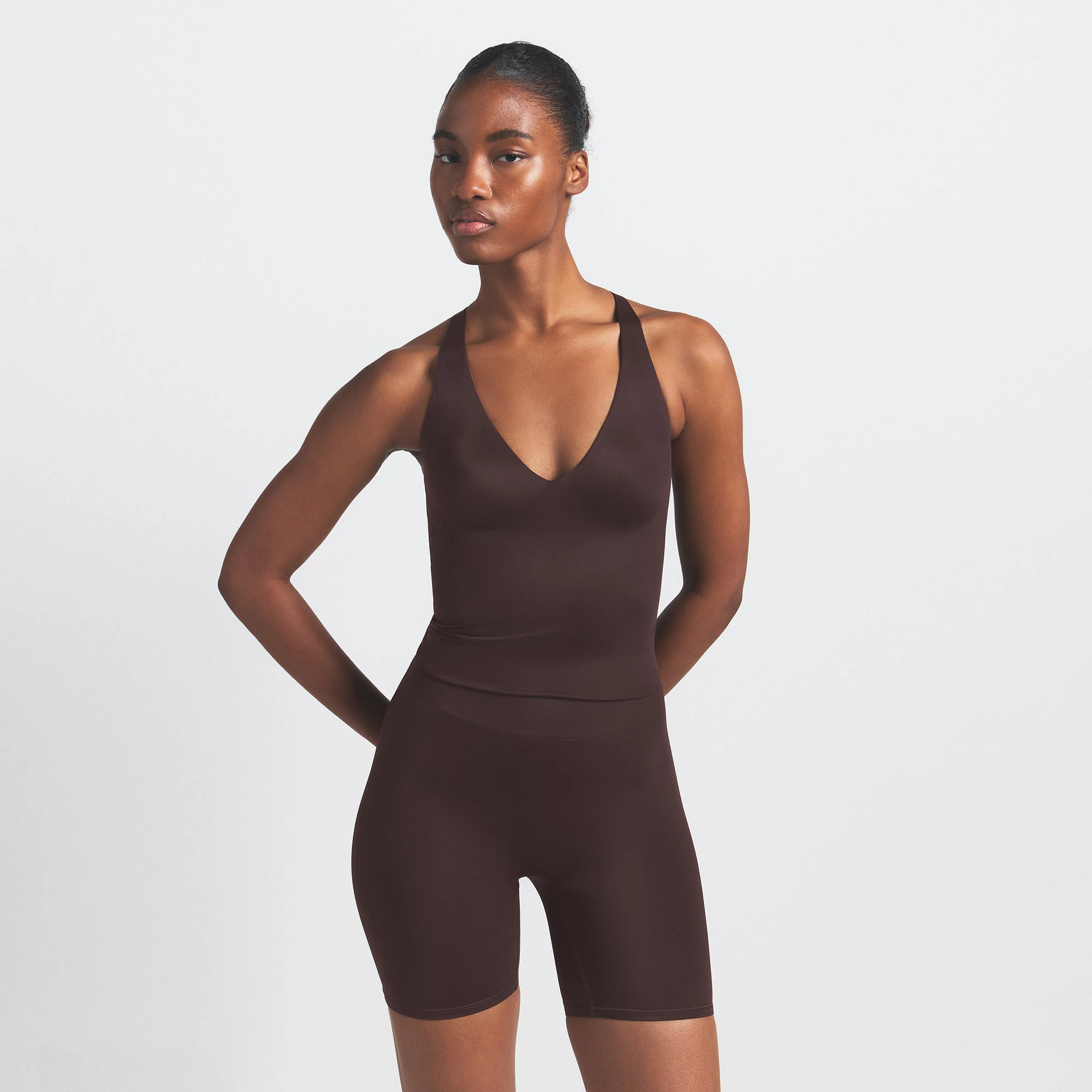 NikeSKIMS SHINE V-NECK TANK | PHOENIX ON A MODEL SIDE VIEW