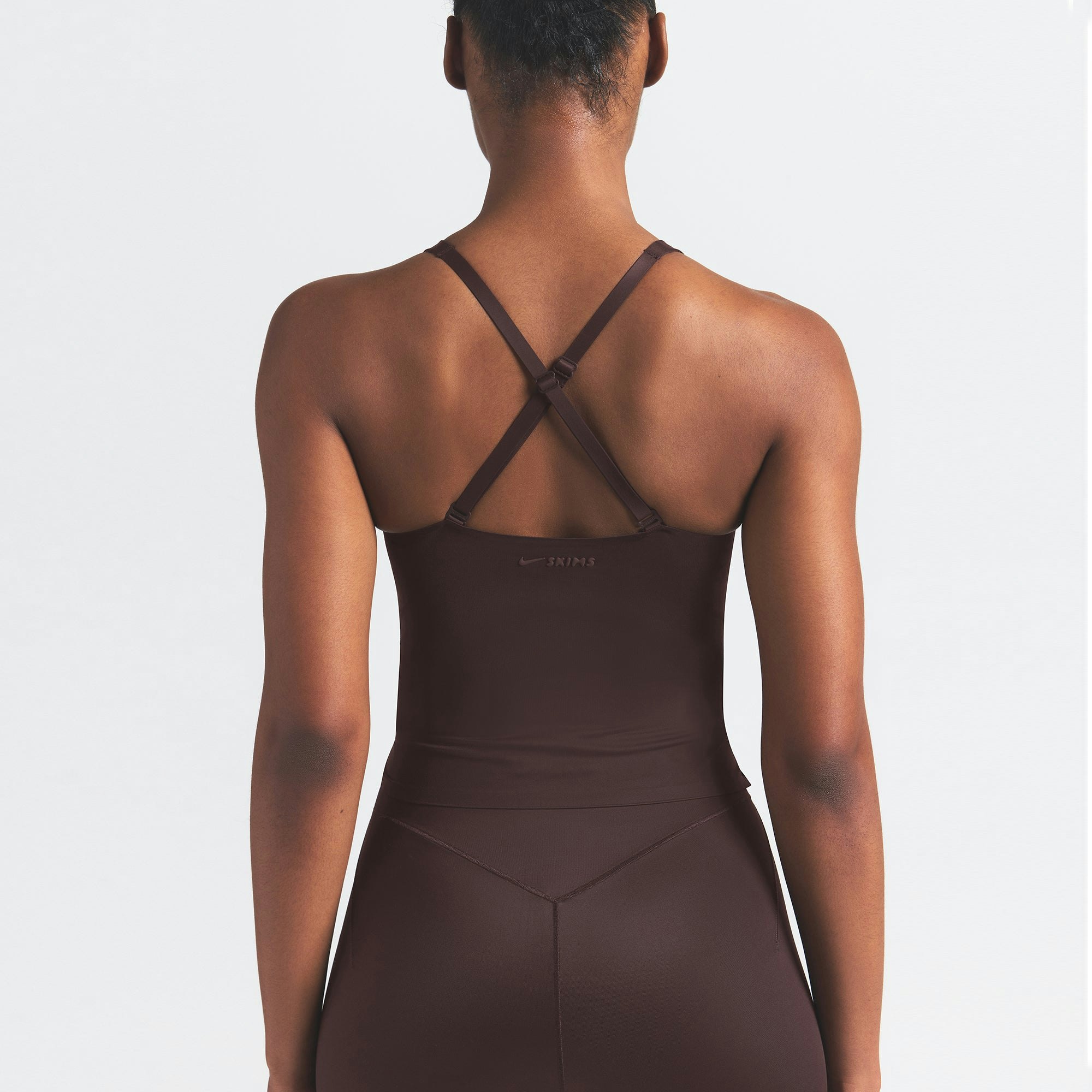 NikeSKIMS SHINE V-NECK TANK | PHOENIX ON A MODEL SIDE VIEW