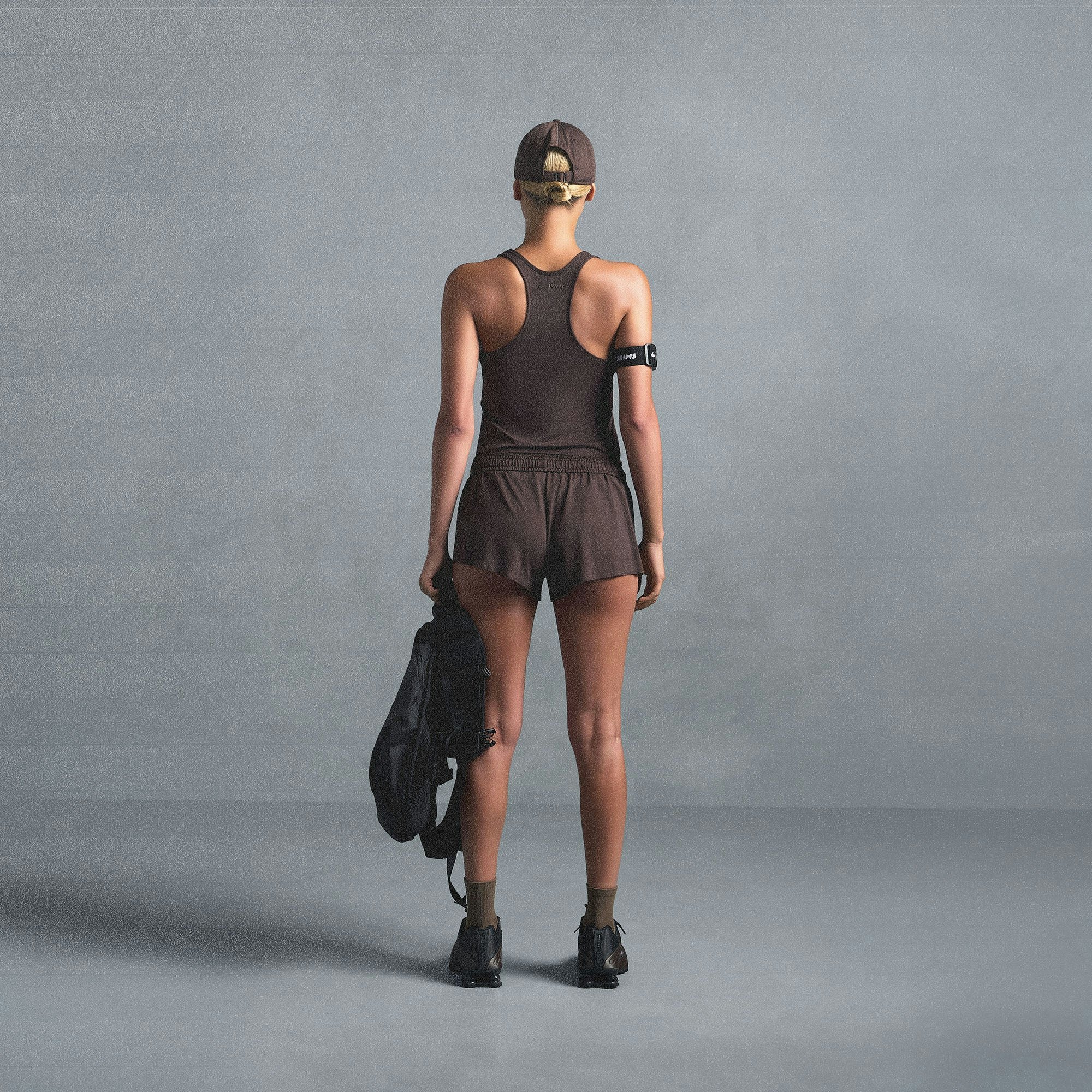 NikeSKIMS AIRY RACER BACK TANK | DARK SEPIA ON A MODEL SIDE VIEW @ | FOCUS: 0.0, 1.0, 0.9