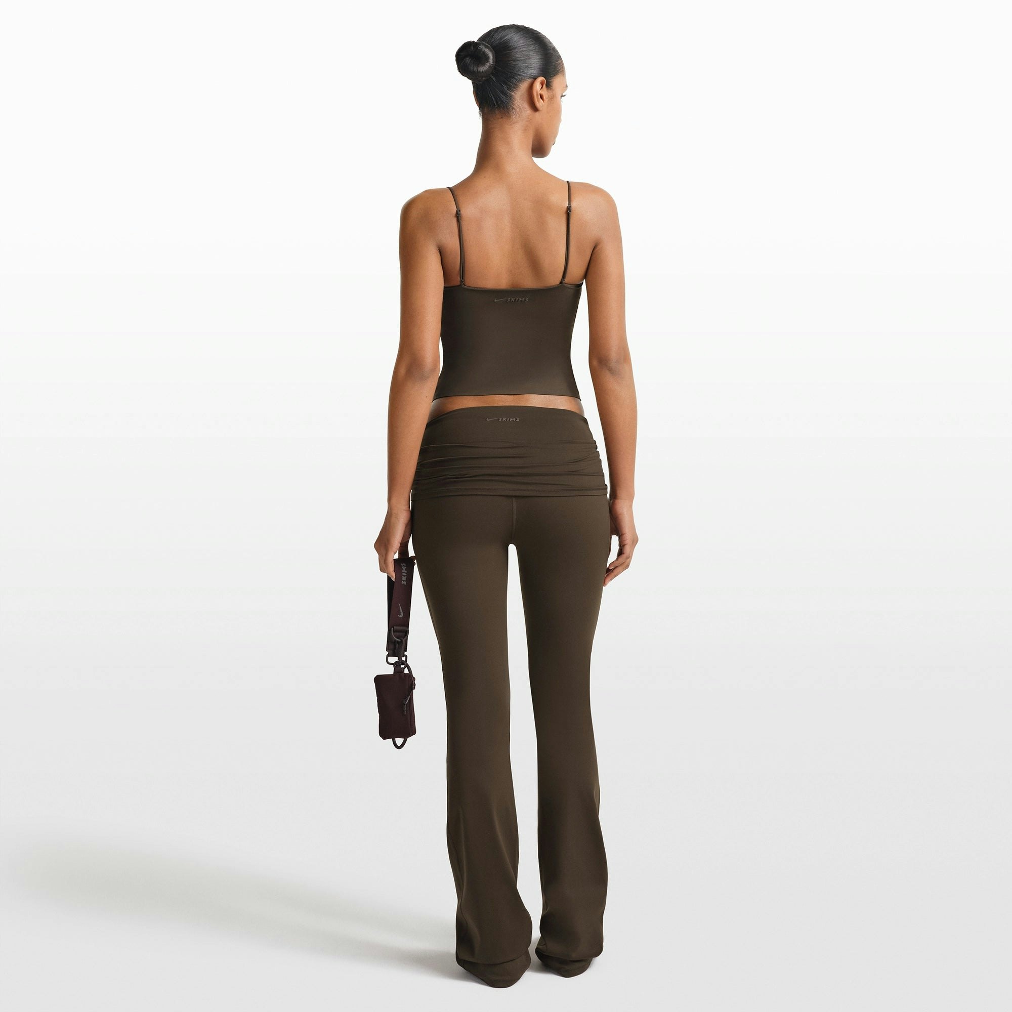 NikeSKIMS MATTE SHIRRED FRONT TANK | DARK SEPIA ON A MODEL FRONT VIEW @ | FOCUS: 0.0, 1.0, 0.9