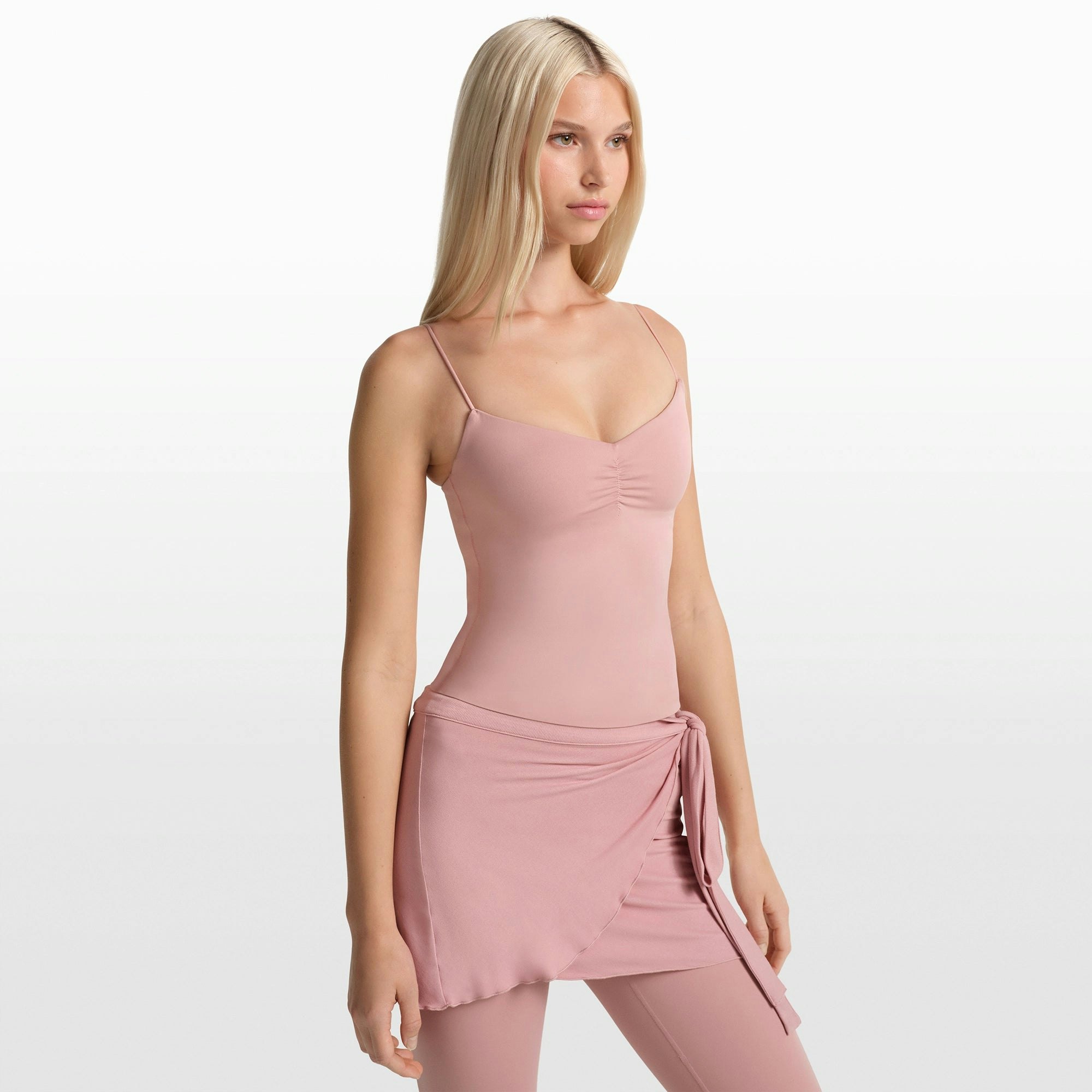 NikeSKIMS MATTE SHIRRED FRONT TANK | HIMALAYAN ON A MODEL FRONT VIEW @ | FOCUS: 0.0, 1.0, 0.9