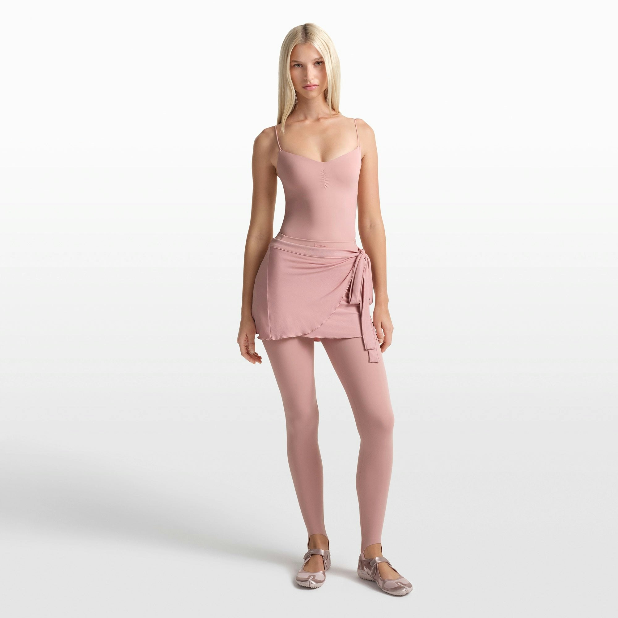 NikeSKIMS MATTE SHIRRED FRONT TANK | HIMALAYAN ON A MODEL FRONT VIEW @ | FOCUS: 0.0, 1.0, 0.9