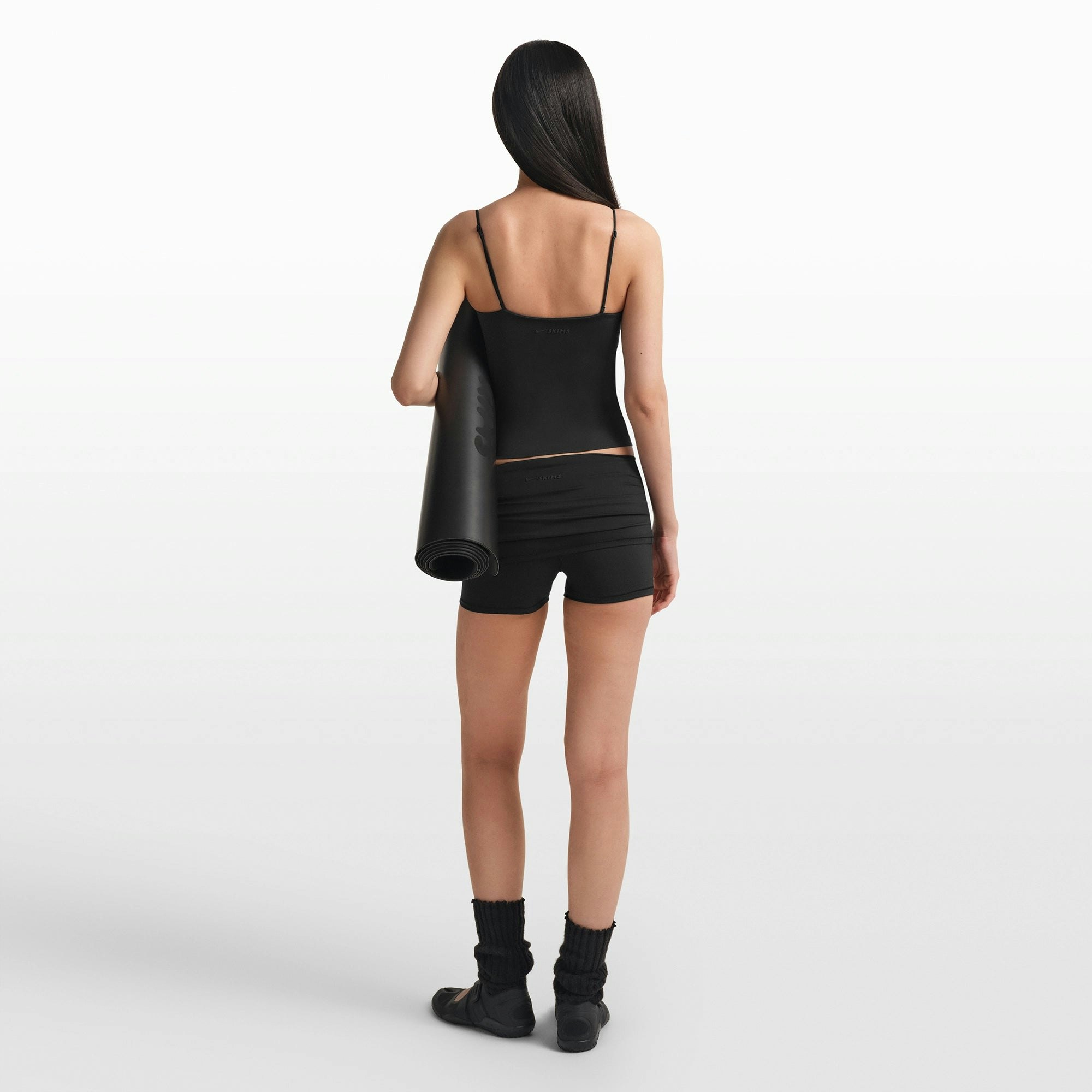 NikeSKIMS MATTE SHIRRED FRONT TANK | OBSIDIAN ON A MODEL FRONT VIEW @ | FOCUS: 0.0, 1.0, 0.9