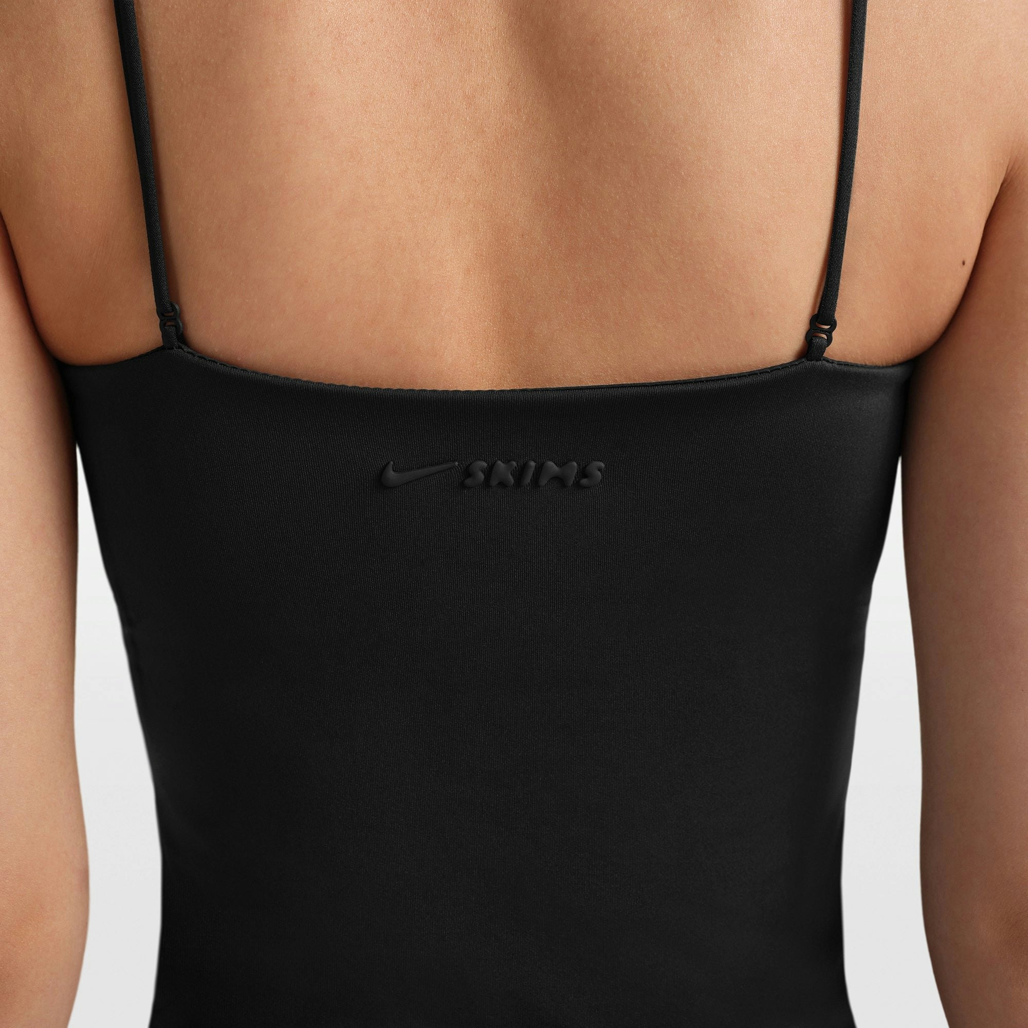 NikeSKIMS MATTE SHIRRED FRONT TANK | OBSIDIAN ON A MODEL FRONT VIEW @ | FOCUS: 0.0, 1.0, 0.9