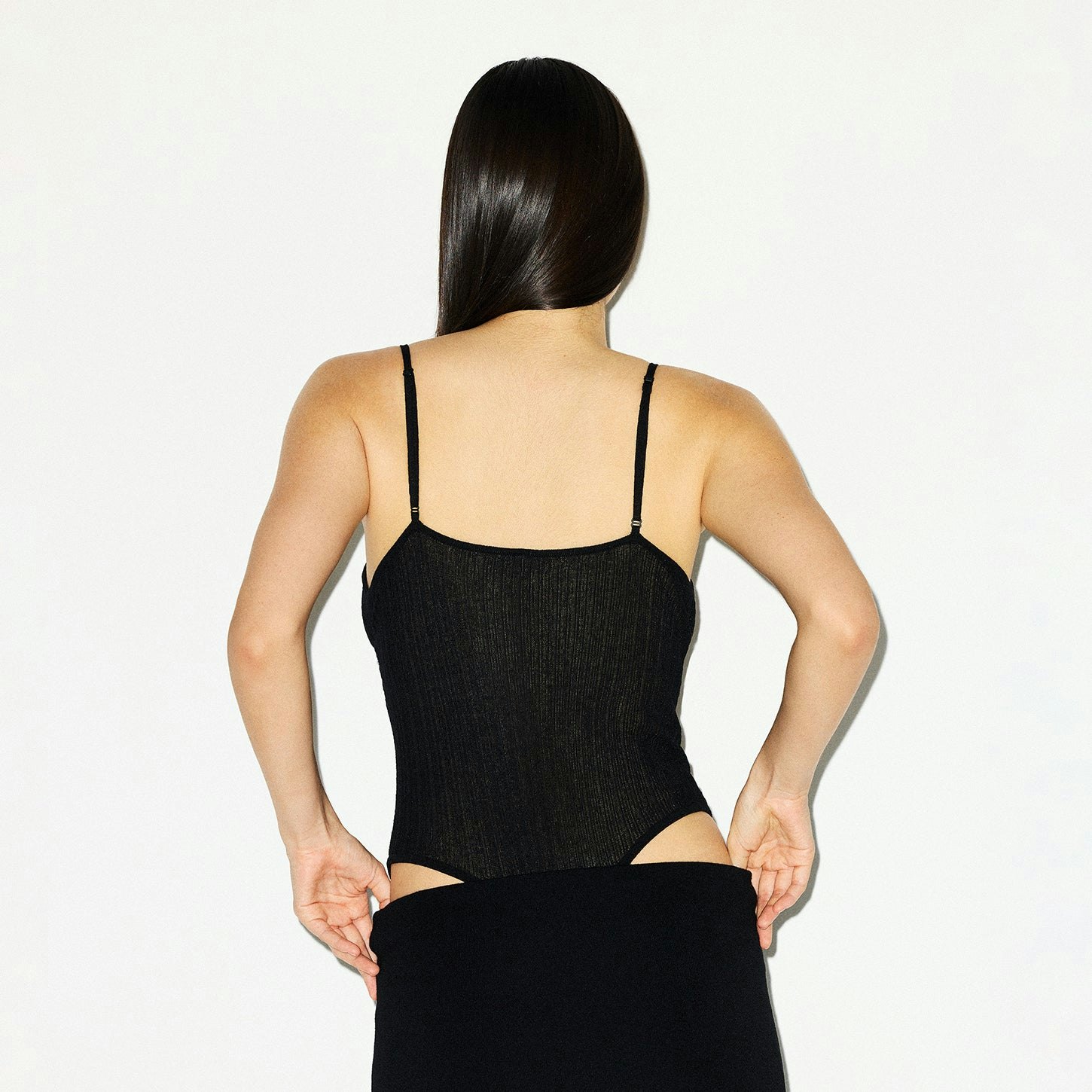 SHEER KNIT CAMI BODYSUIT | ONYX ON A MODEL BACK VIEW @ | FOCUS: 0.0, 1.0, 0.9