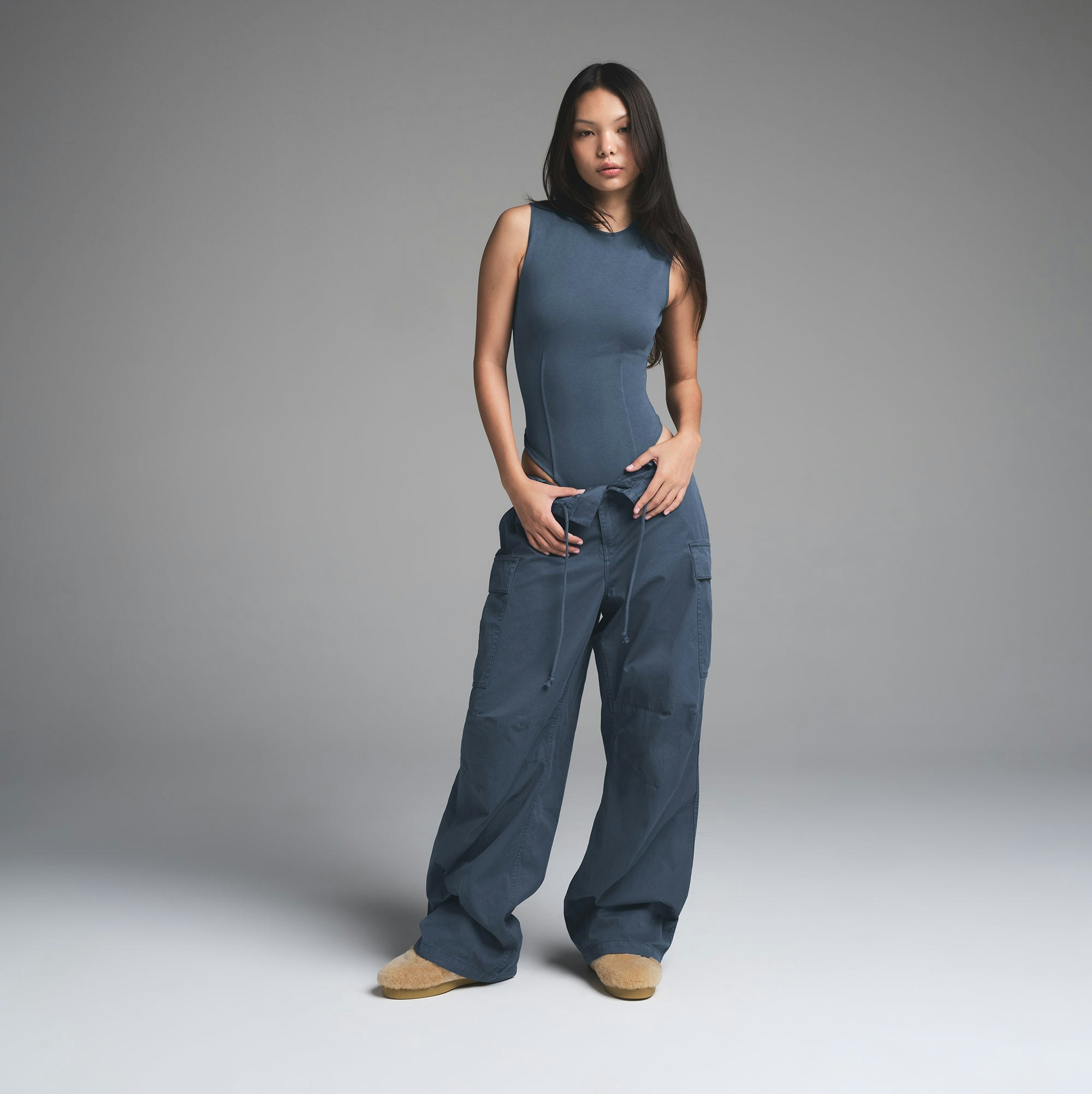 OUTDOOR OPEN BACK BODYSUIT | INDIGO ON A MODEL FRONT VIEW | FOCUS: 0.0, 1.0, 0.9