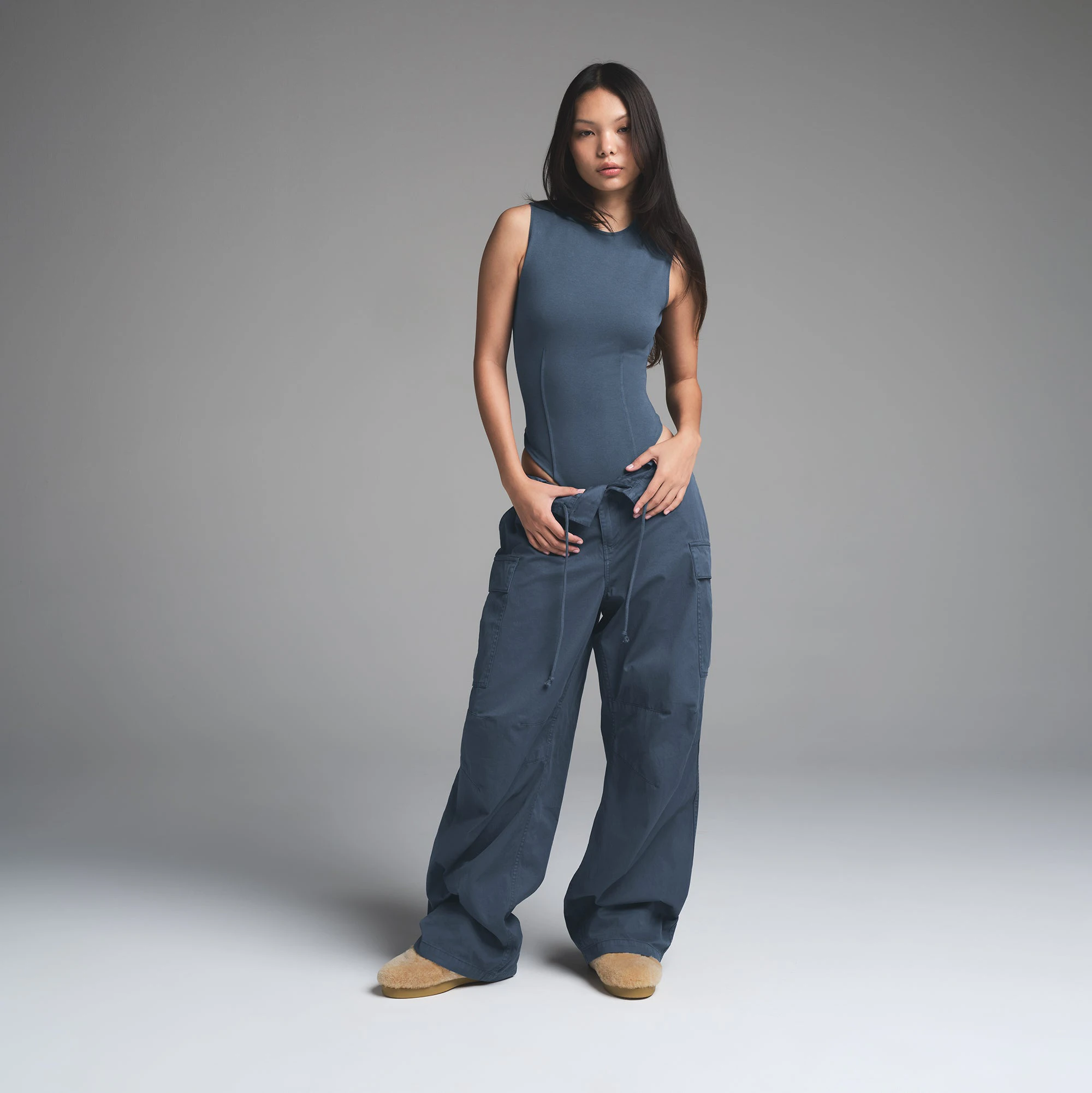 OUTDOOR OPEN BACK BODYSUIT | INDIGO ON A MODEL FRONT VIEW | FOCUS: 0.0, 1.0, 0.9