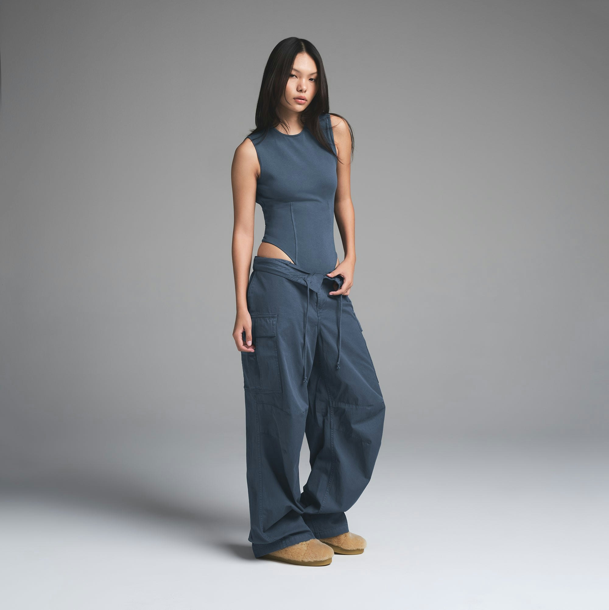 OUTDOOR OPEN BACK BODYSUIT | INDIGO ON A MODEL FRONT VIEW | FOCUS: 0.0, 1.0, 0.9