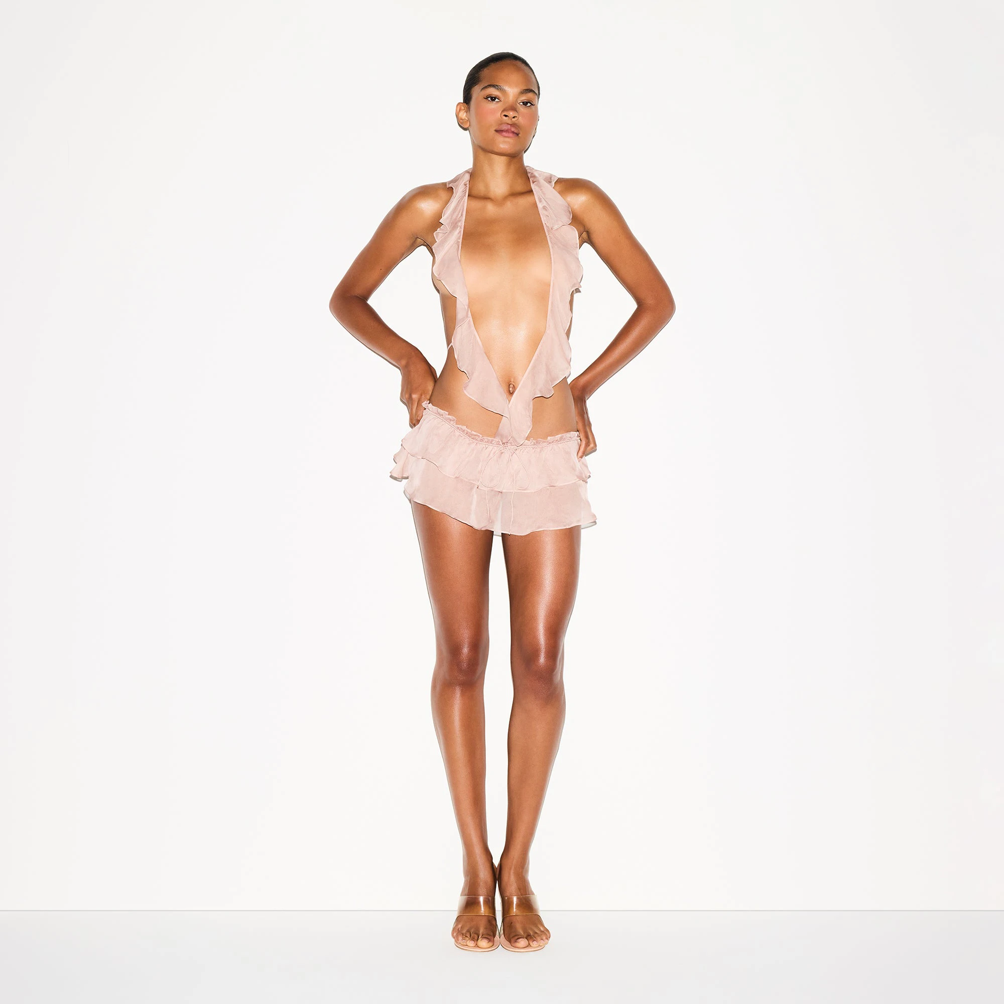 SKIMS ROMANCE DEEP PLUNGE TEDDY | LIGHT FAWN ON A MODEL FRONT VIEW