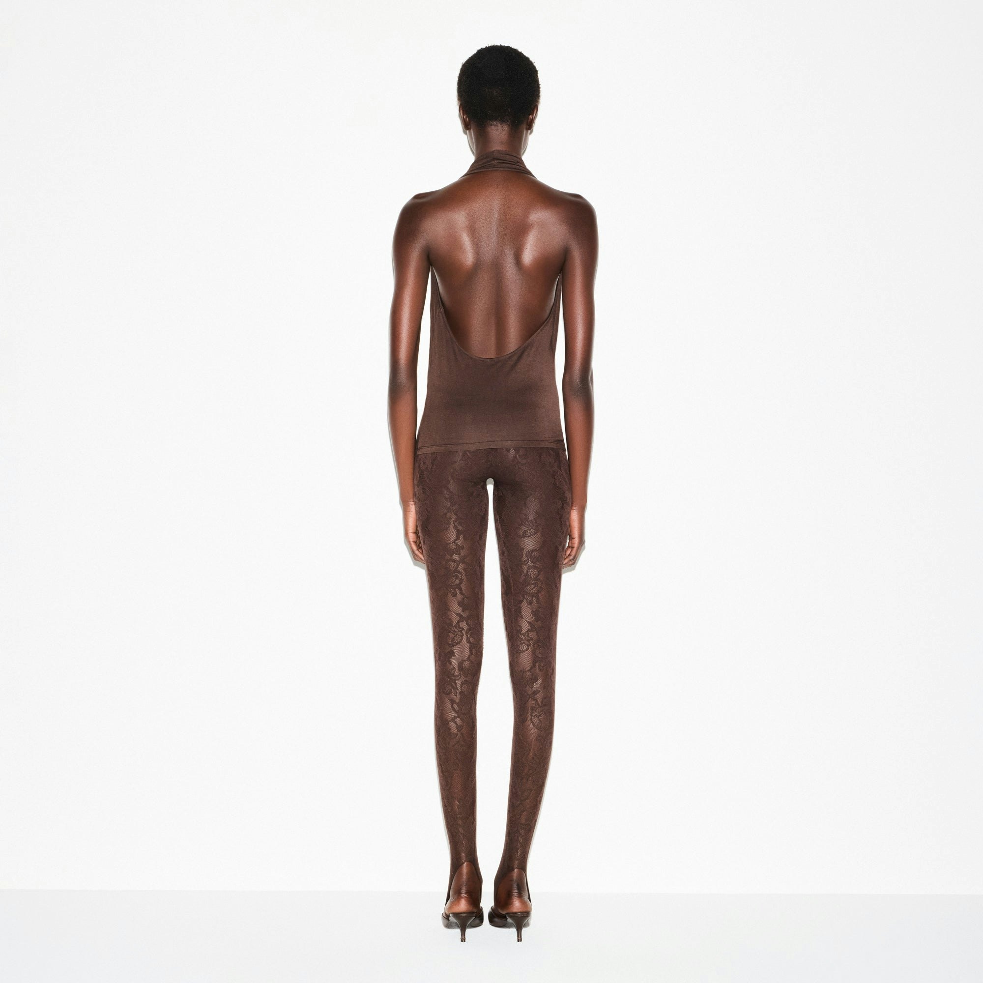 SMOOTH LAYERS DEEP PLUNGE HALTER TOP | ESPRESSO ON A MODEL SIDE VIEW @ | FOCUS: 0.0, 1.0, 0.9