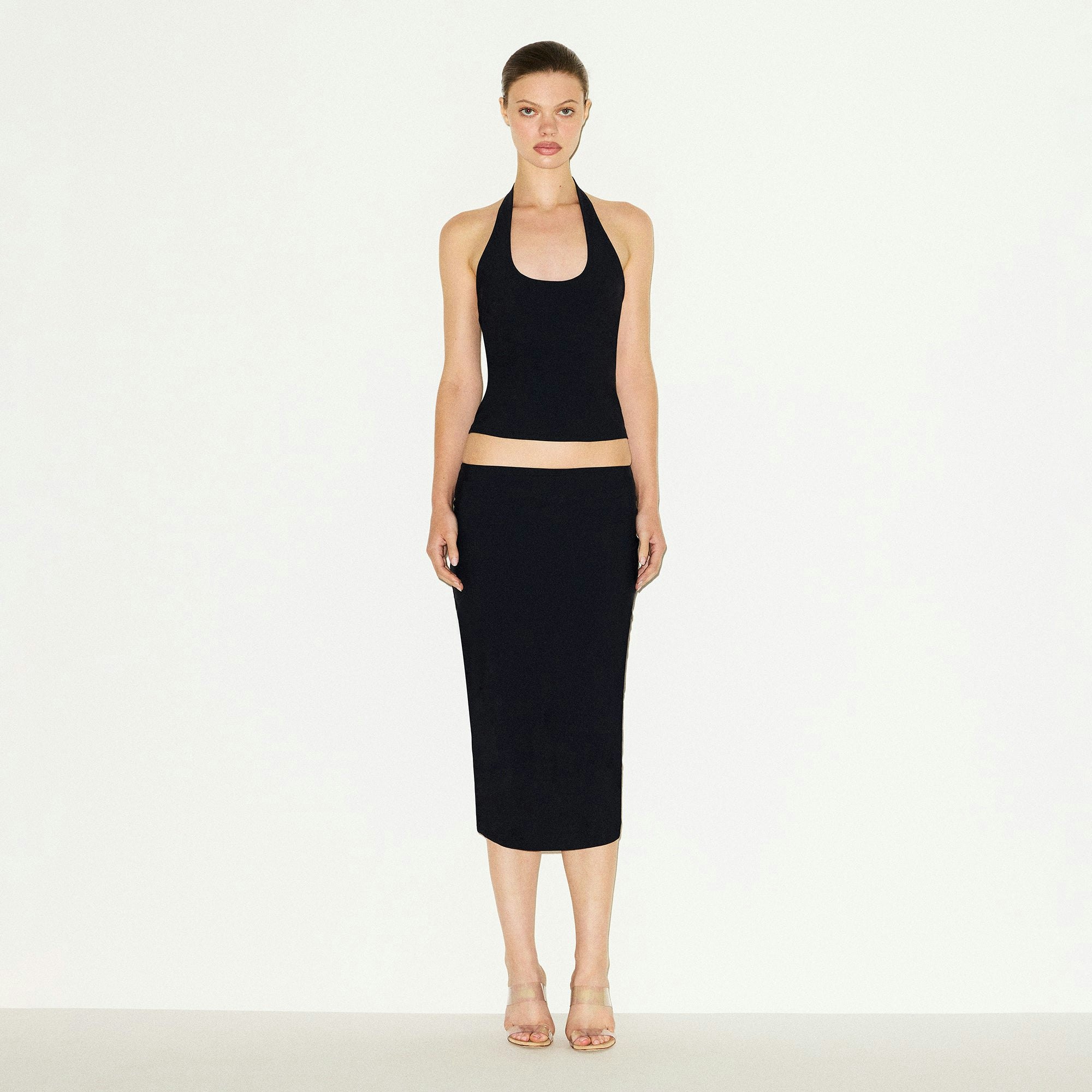 CLING MATTE HALTER TOP | OBSIDIAN ON A MODEL FRONT VIEW @ | FOCUS: 0.0, 1.0, 0.9