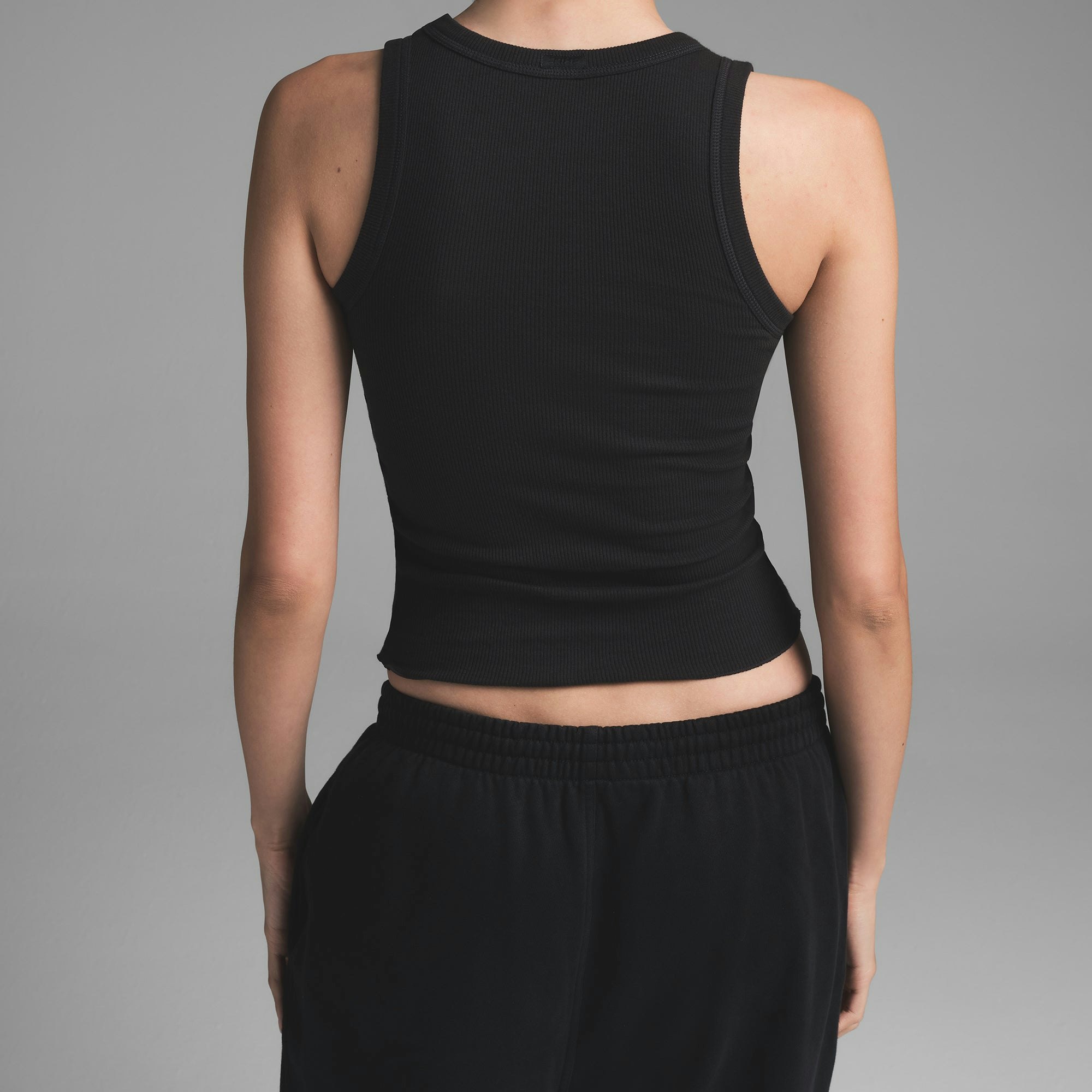 COTTON RIB SCOOP NECK TANK | SOOT ON A MODEL BACK VIEW | FOCUS: 0.0, 1.0, 0.9